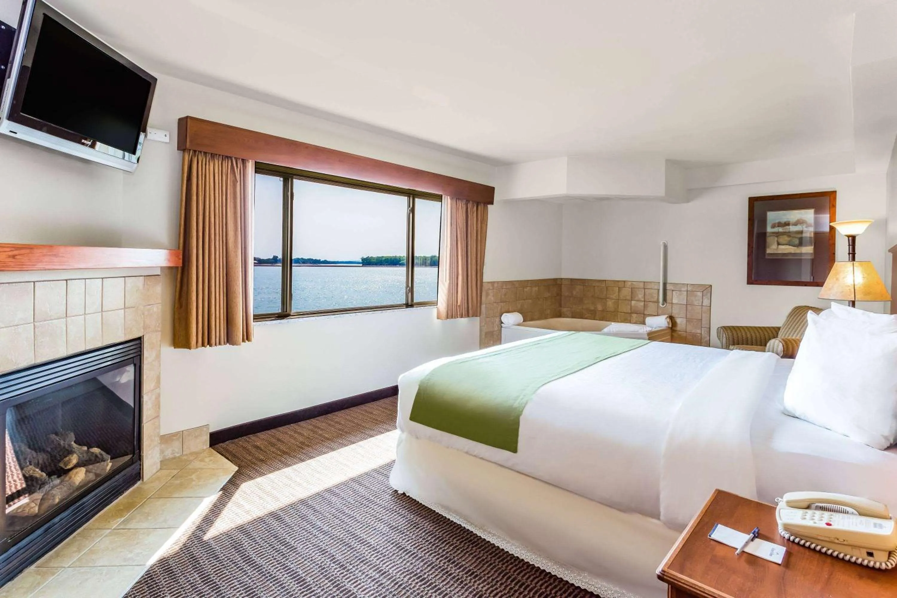 Bed in AmericInn by Wyndham Fort Pierre Conference Center