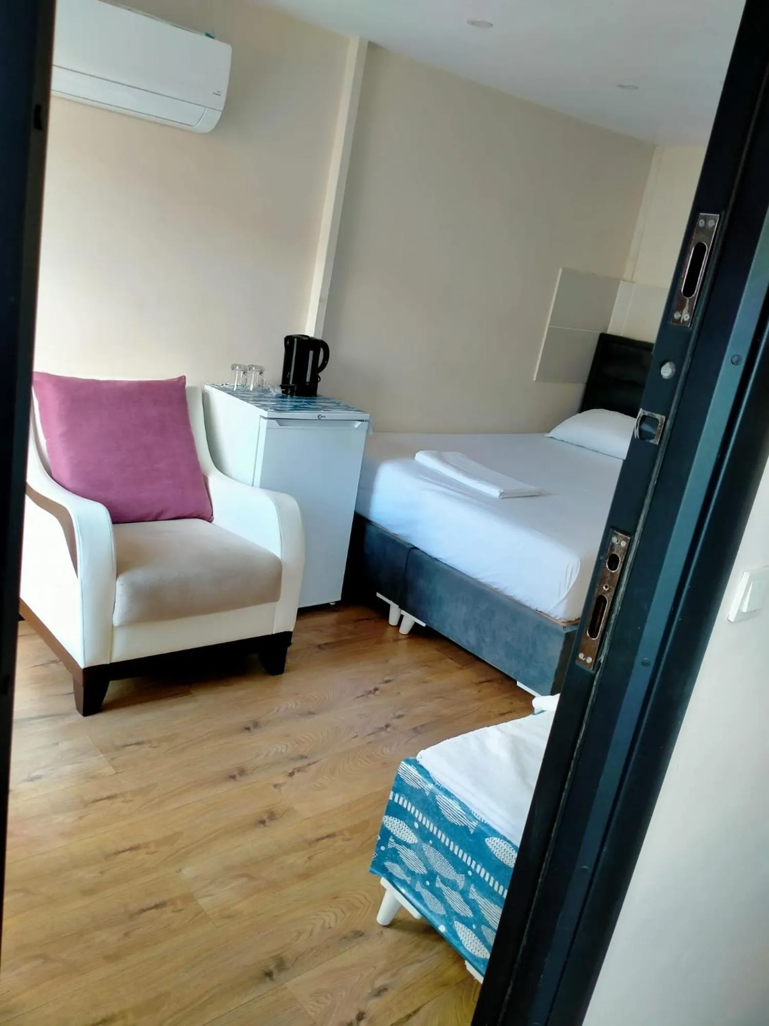 Seating area, Bed in BLUE ROYAL HOTEL