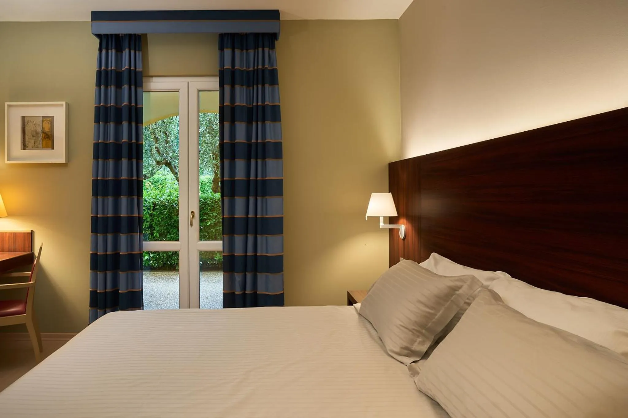 Bed in Delfina Palace Hotel