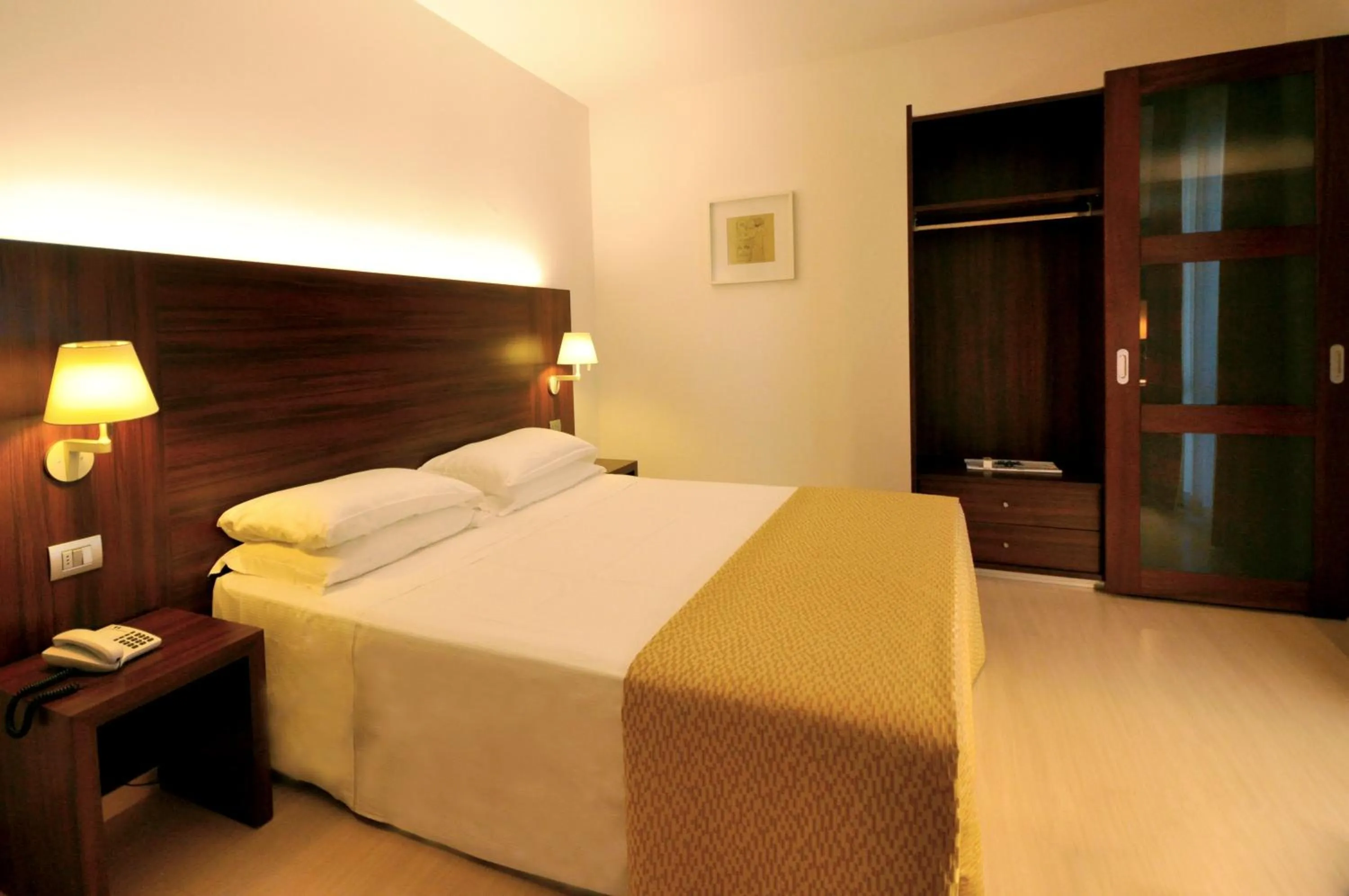 Bed in Delfina Palace Hotel