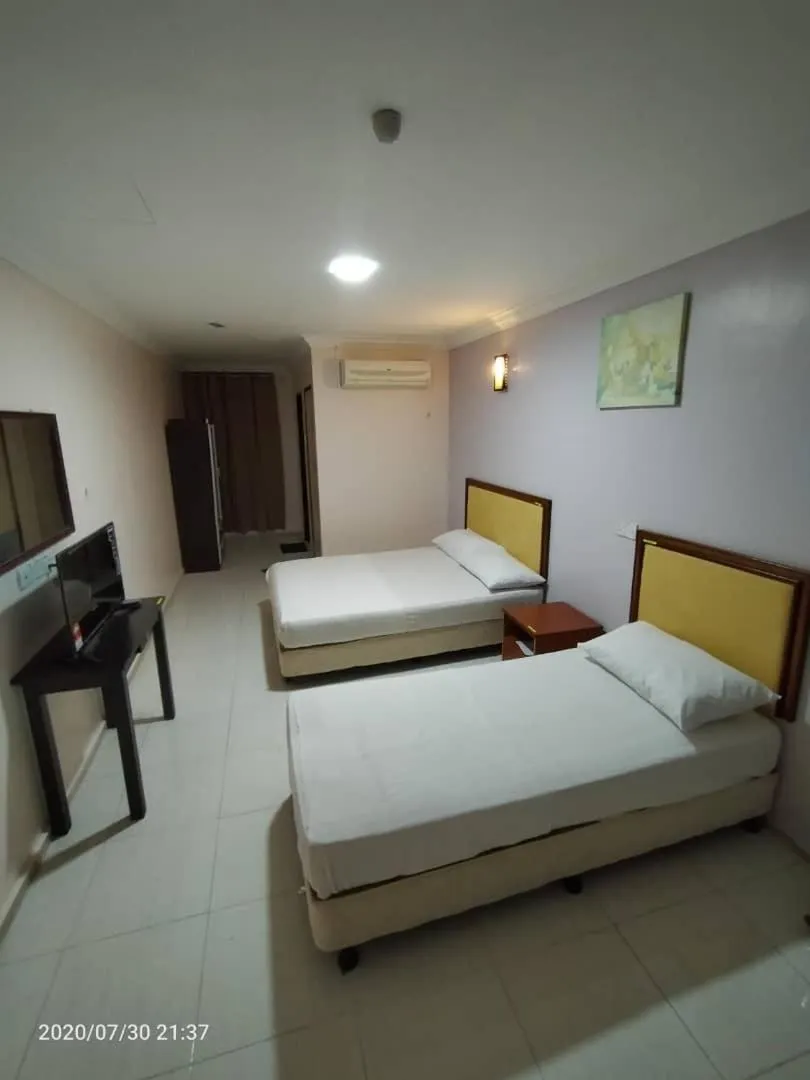 Photo of the whole room, Bed in TAMIM SUITE GROUP HOTEL Dungun