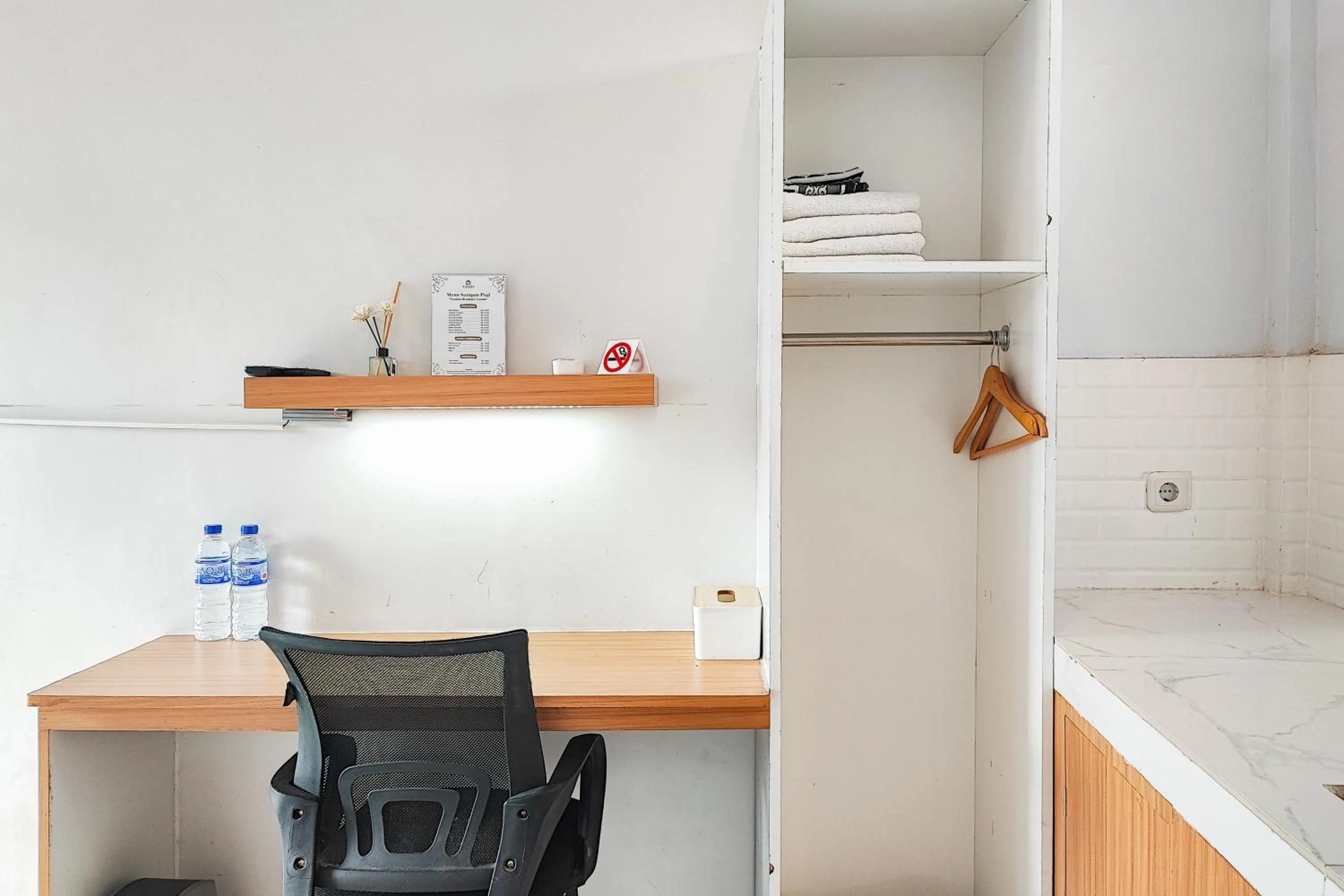 Seating area in Urbanview Hotel Syariah at Waskita Residence Telanaipura