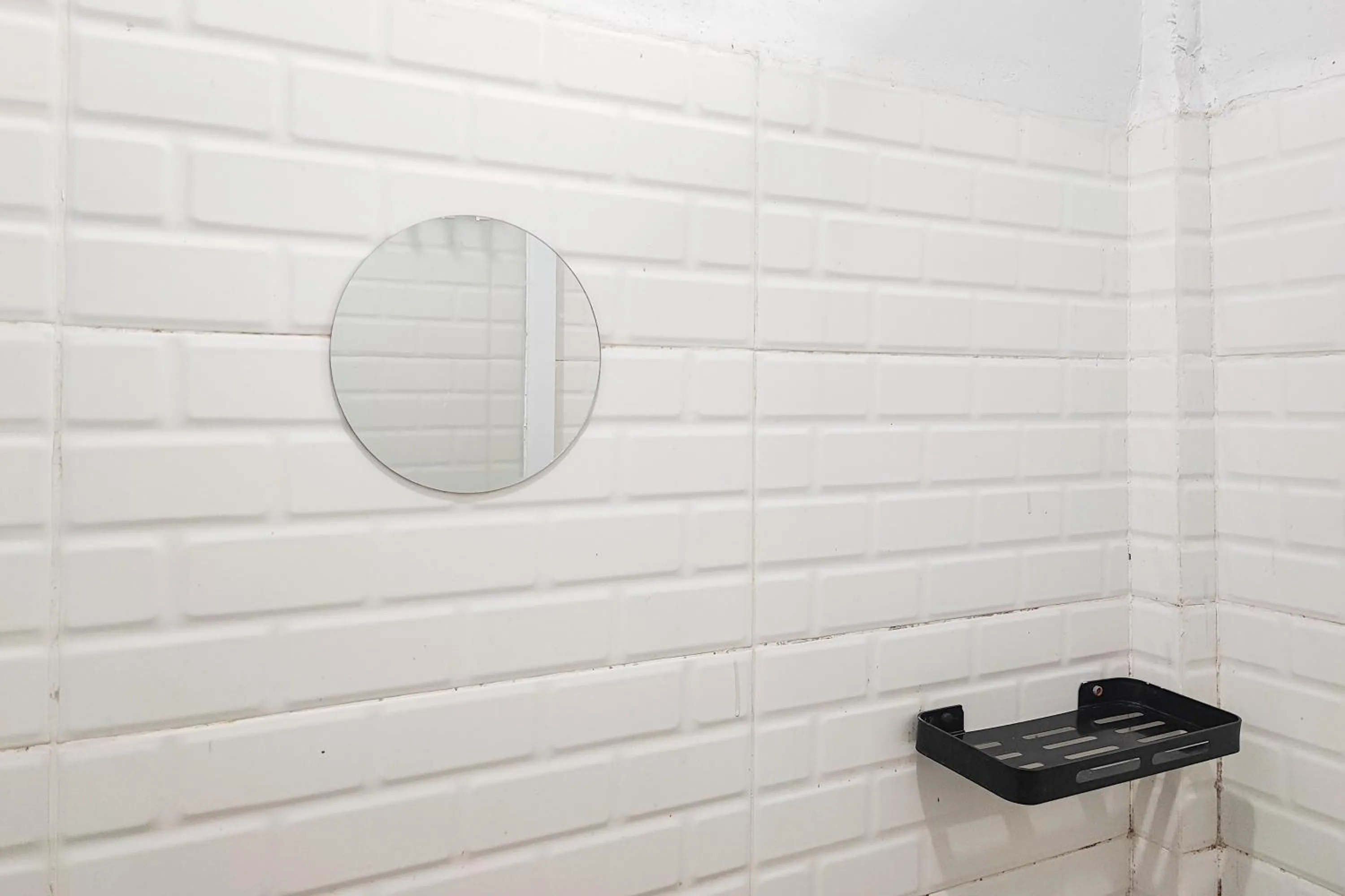 Bathroom in Urbanview Hotel Syariah at Waskita Residence Telanaipura