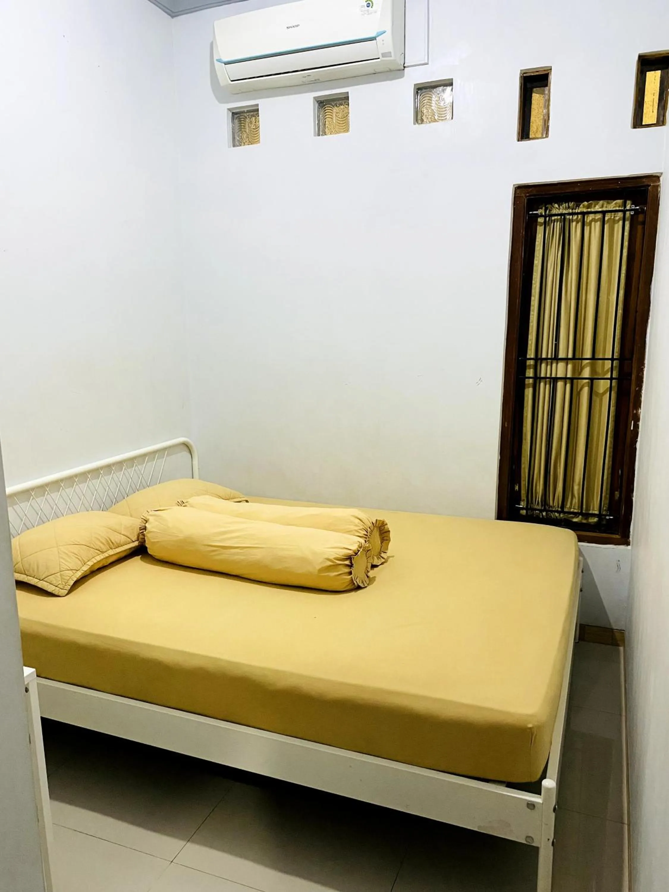 Bed in IB Homestay Syariah by Ecommerceloka