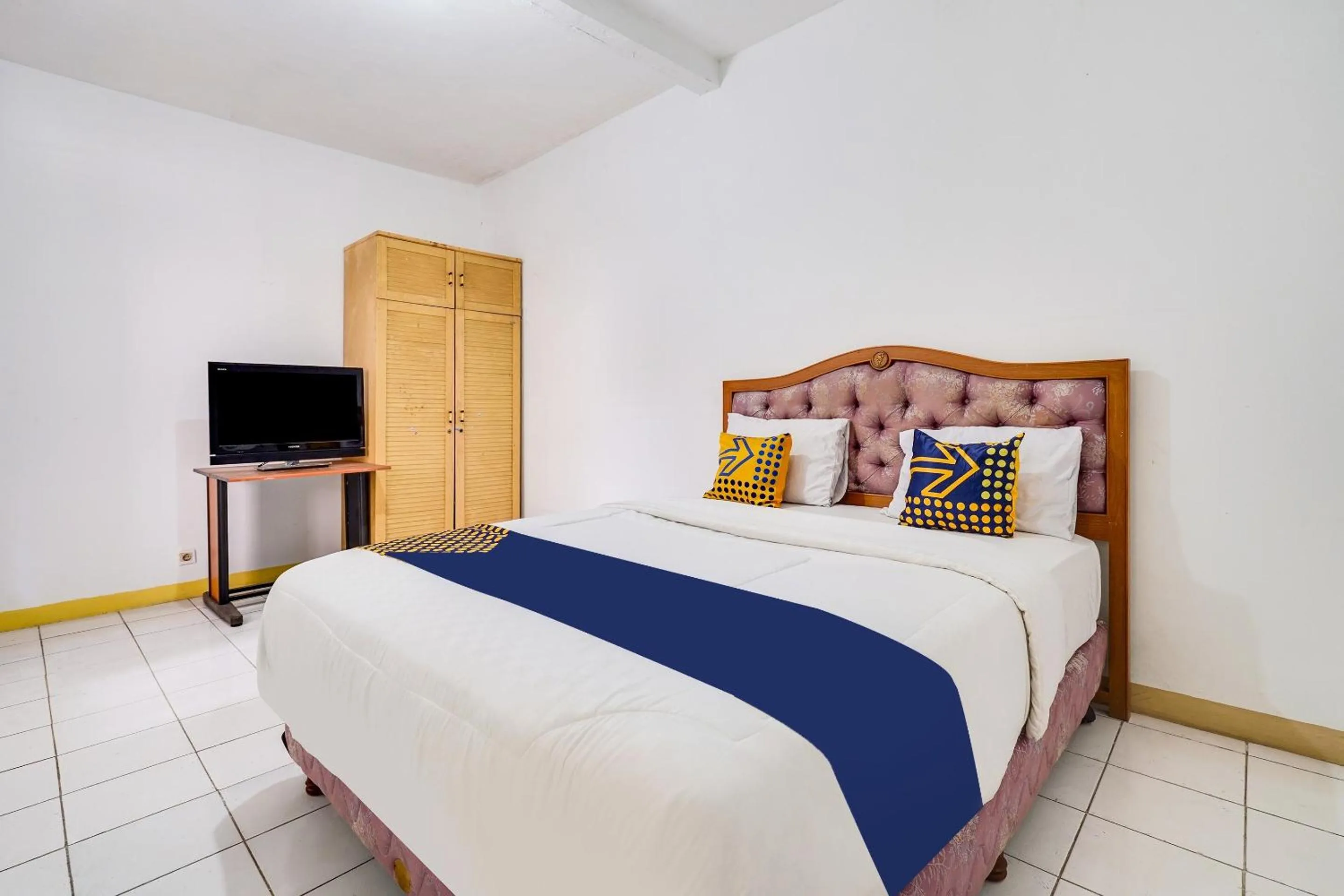 Bedroom in OYO 91546 Dewi Sudirman Homestay