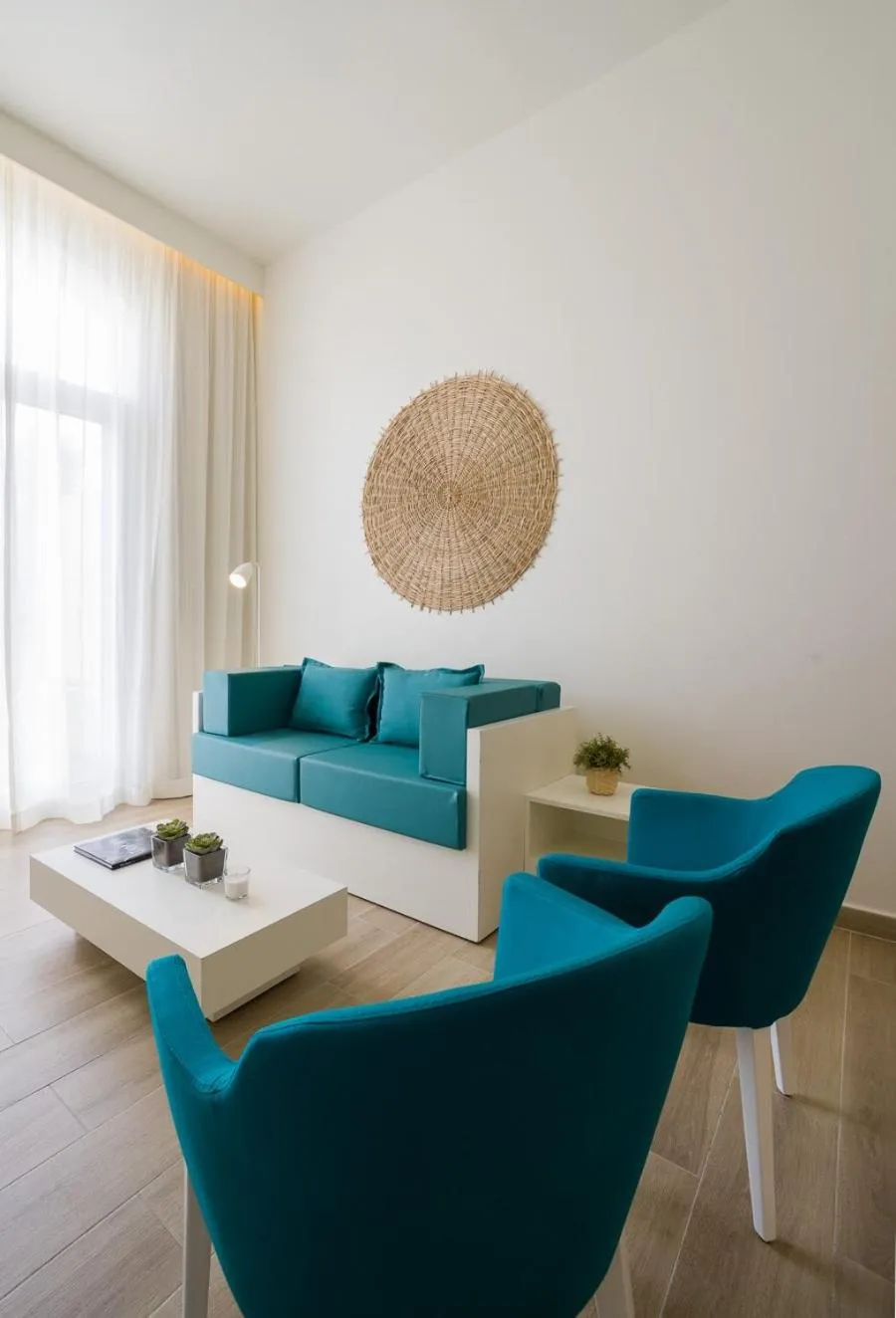 Communal lounge/ TV room in Oasis Tarrafal Alfandega Suites