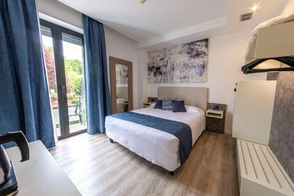 Bed in Hotel Le Palme