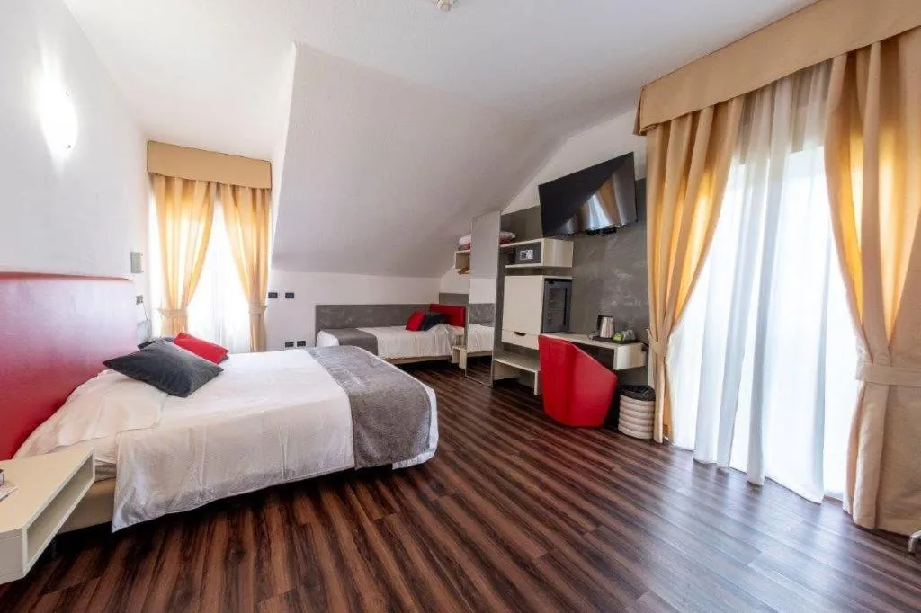 Bed in Hotel Le Palme