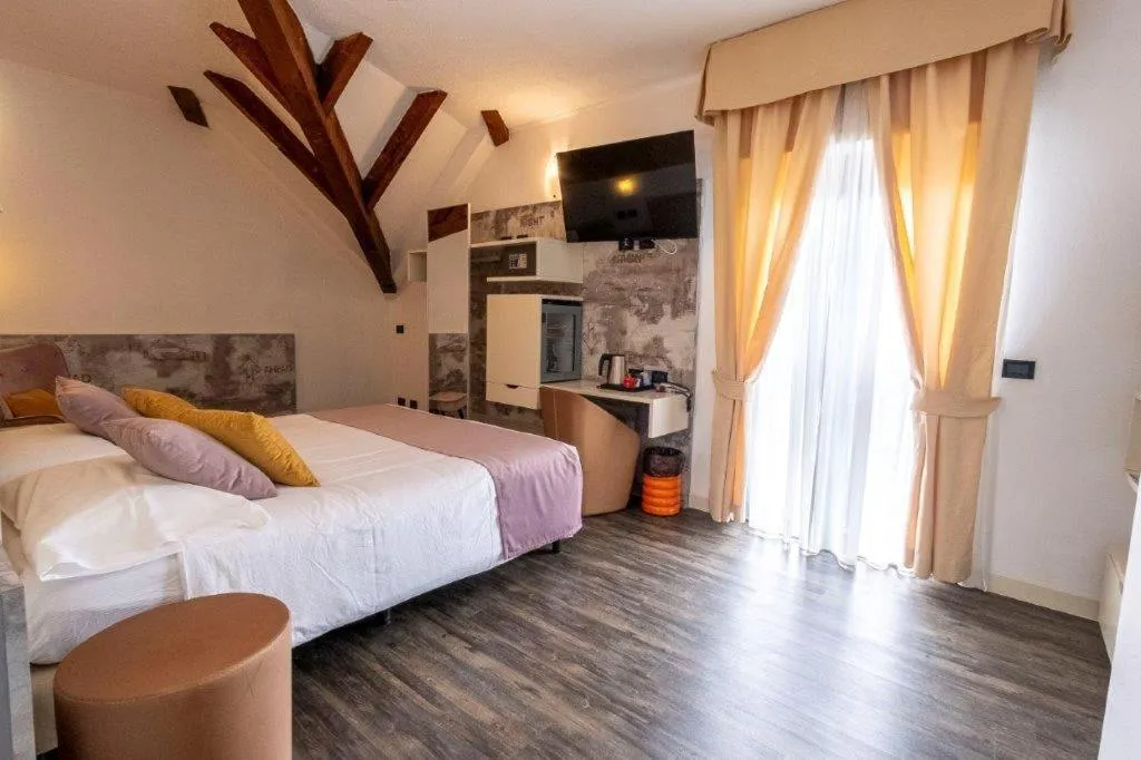 Bed in Hotel Le Palme