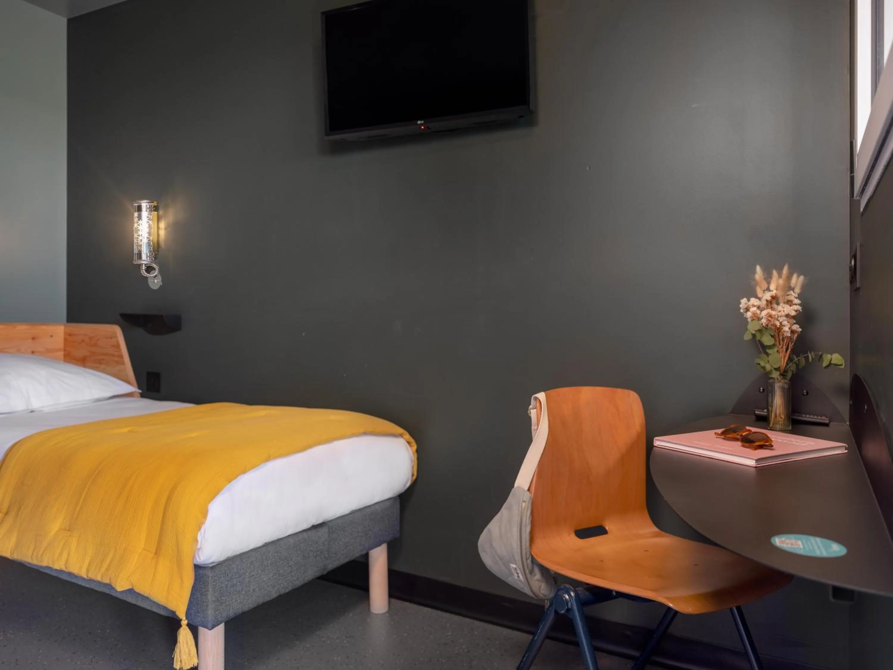 Bed in Eklo Hotels Paris Roissy CDG Airport