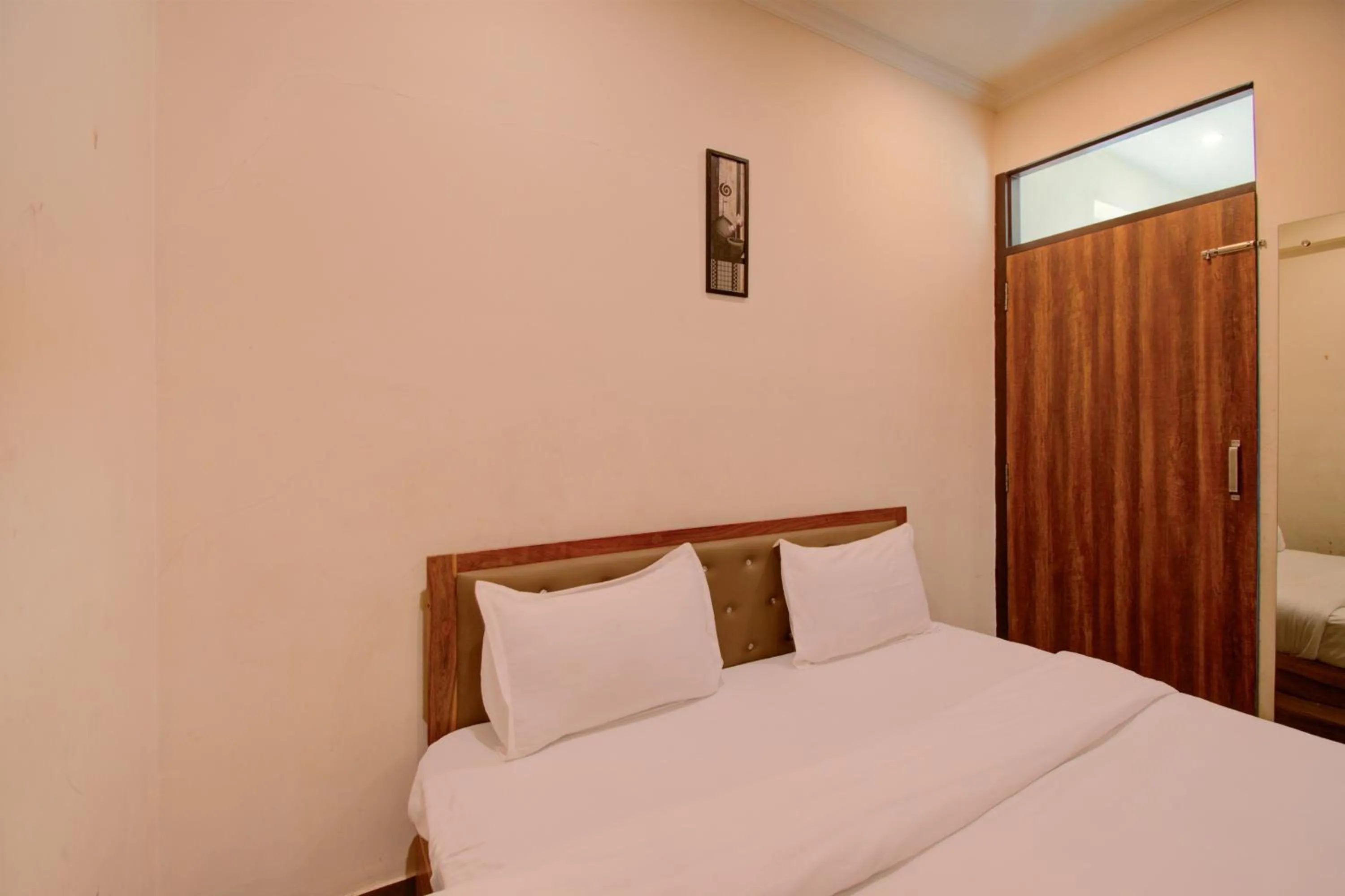 Bed in Hotel Bhagwati Palace
