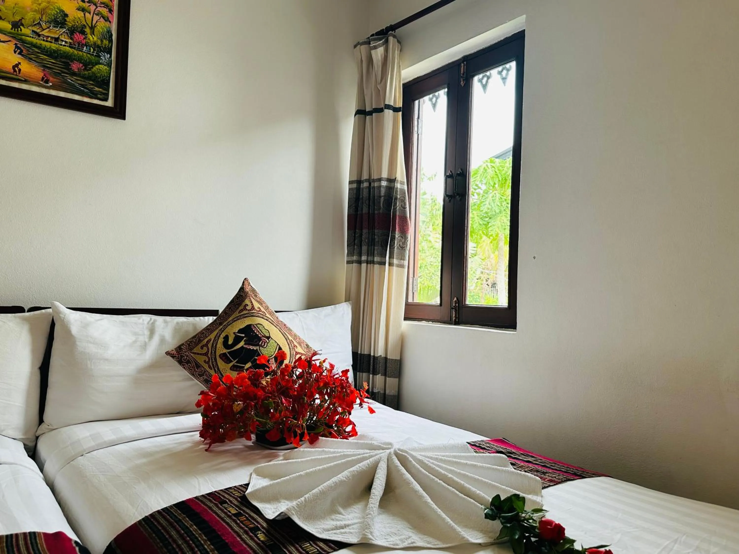 Bed in Thatsaphone Hotel