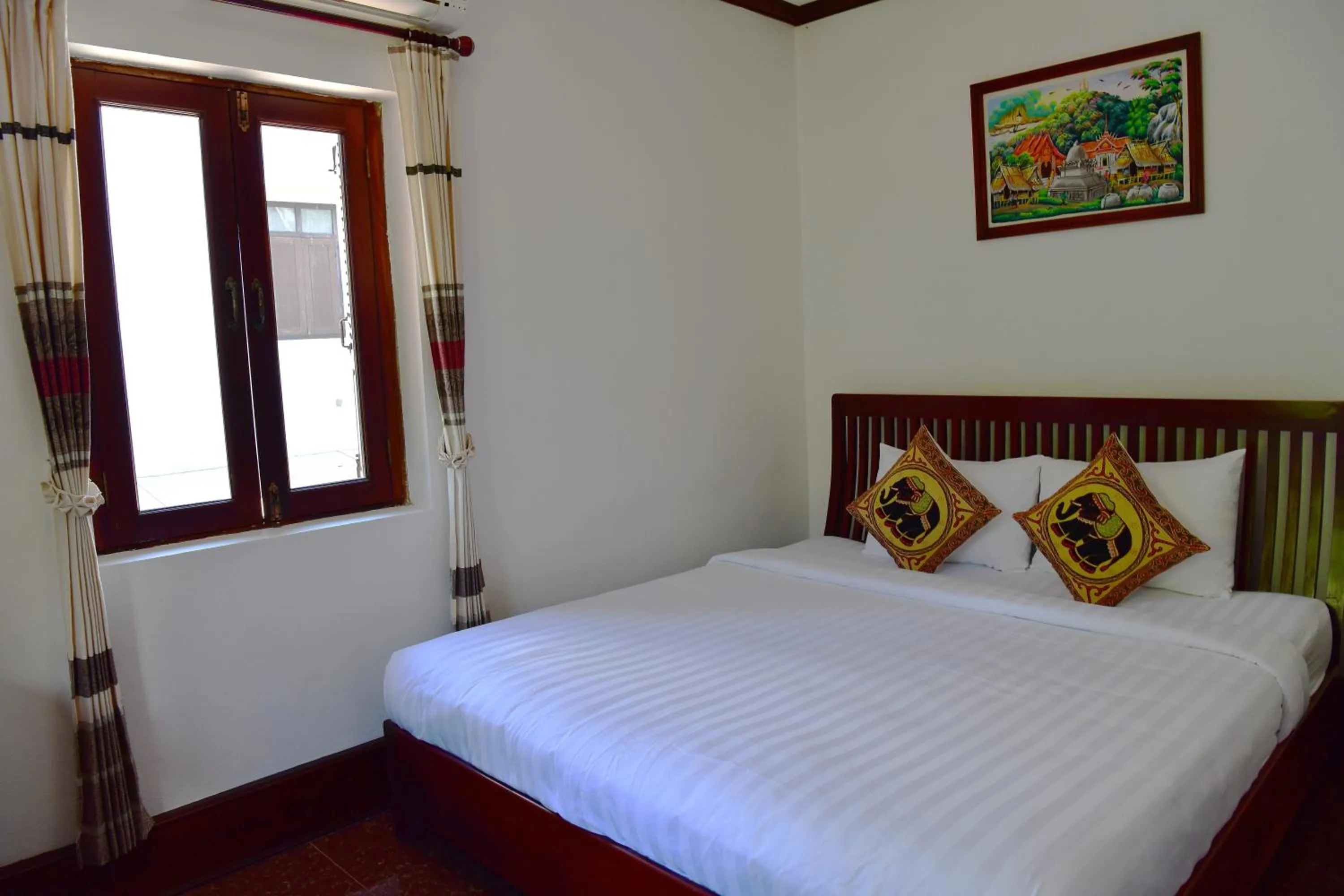 Bed in Thatsaphone Hotel