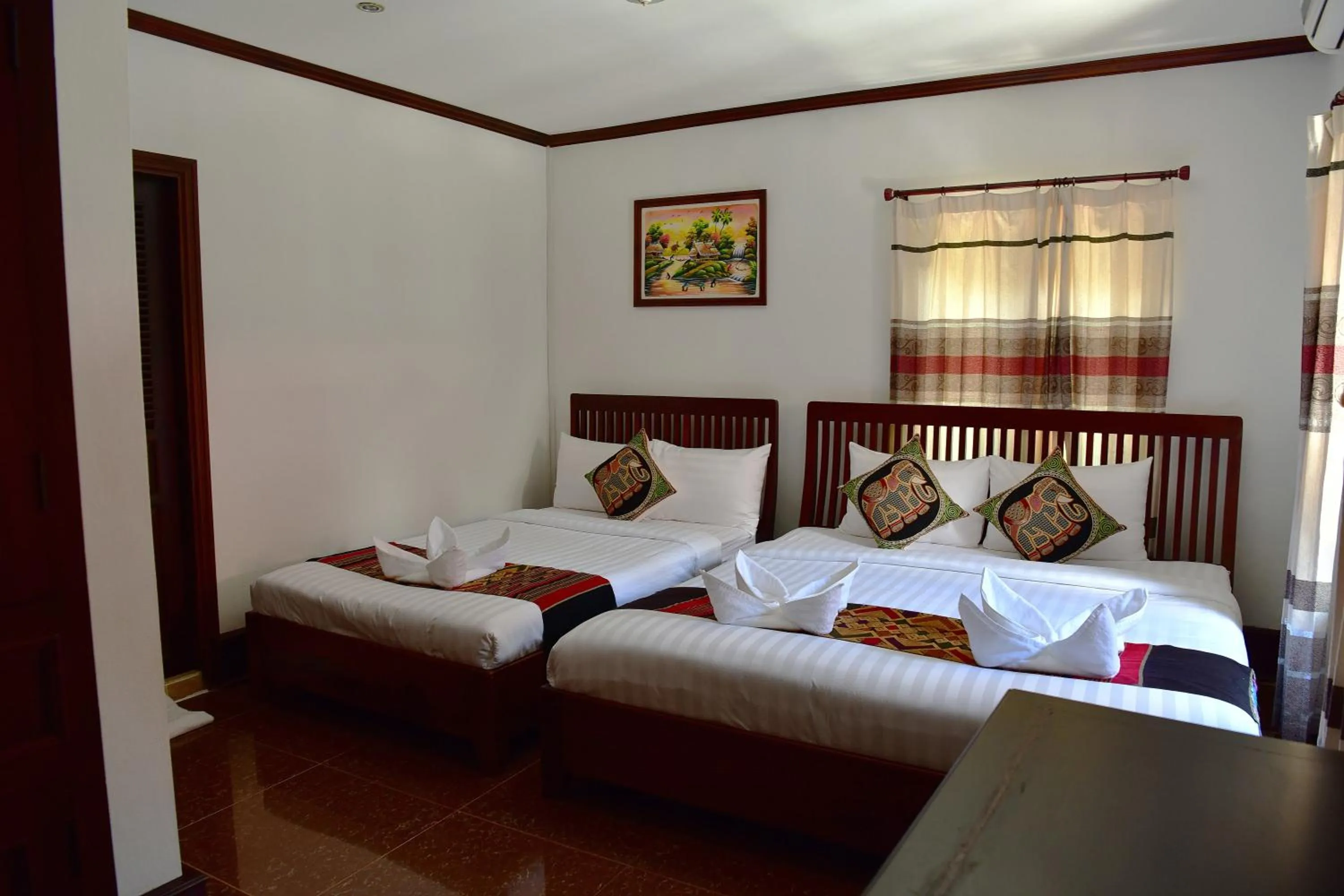 Bed in Thatsaphone Hotel