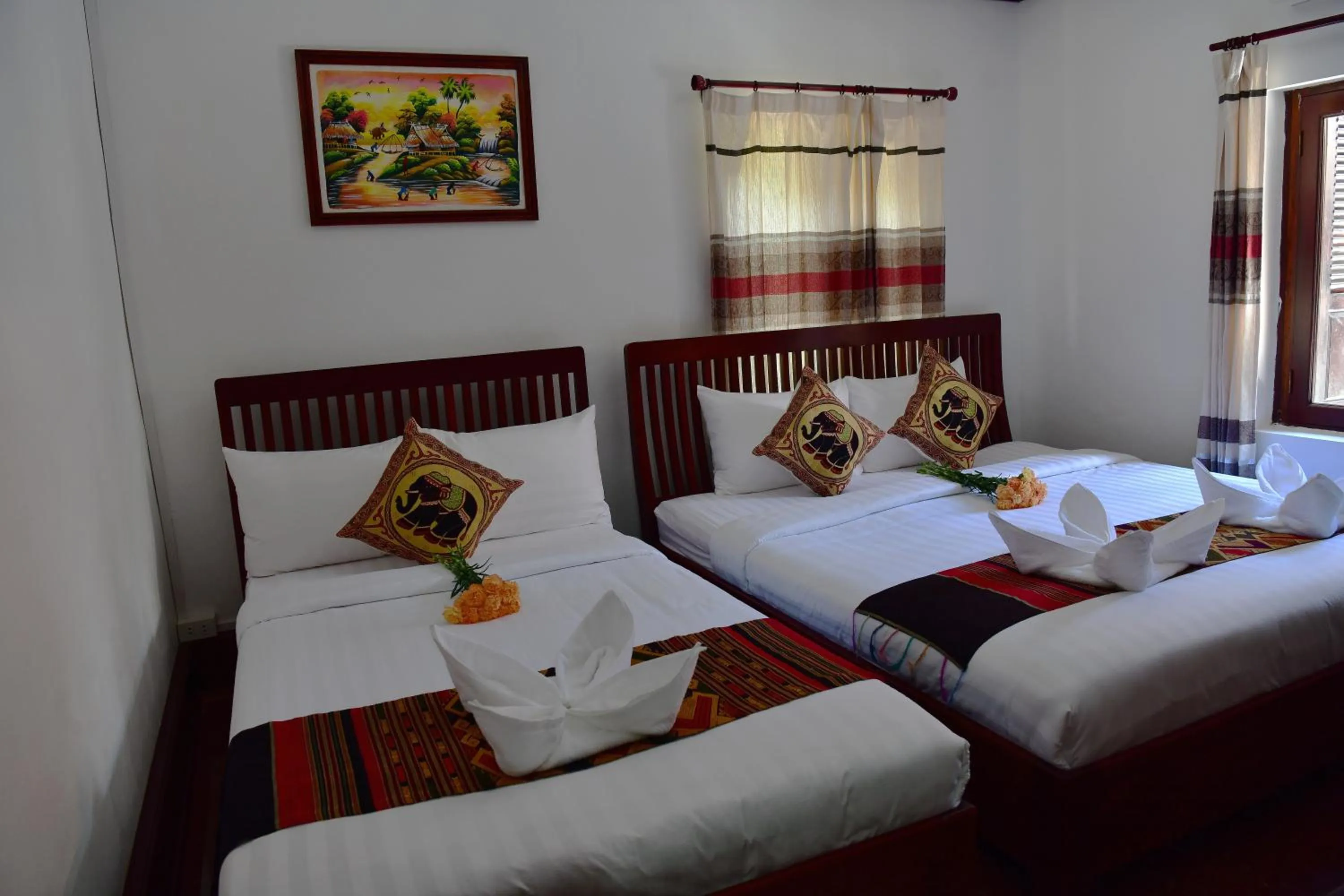 Bed in Thatsaphone Hotel