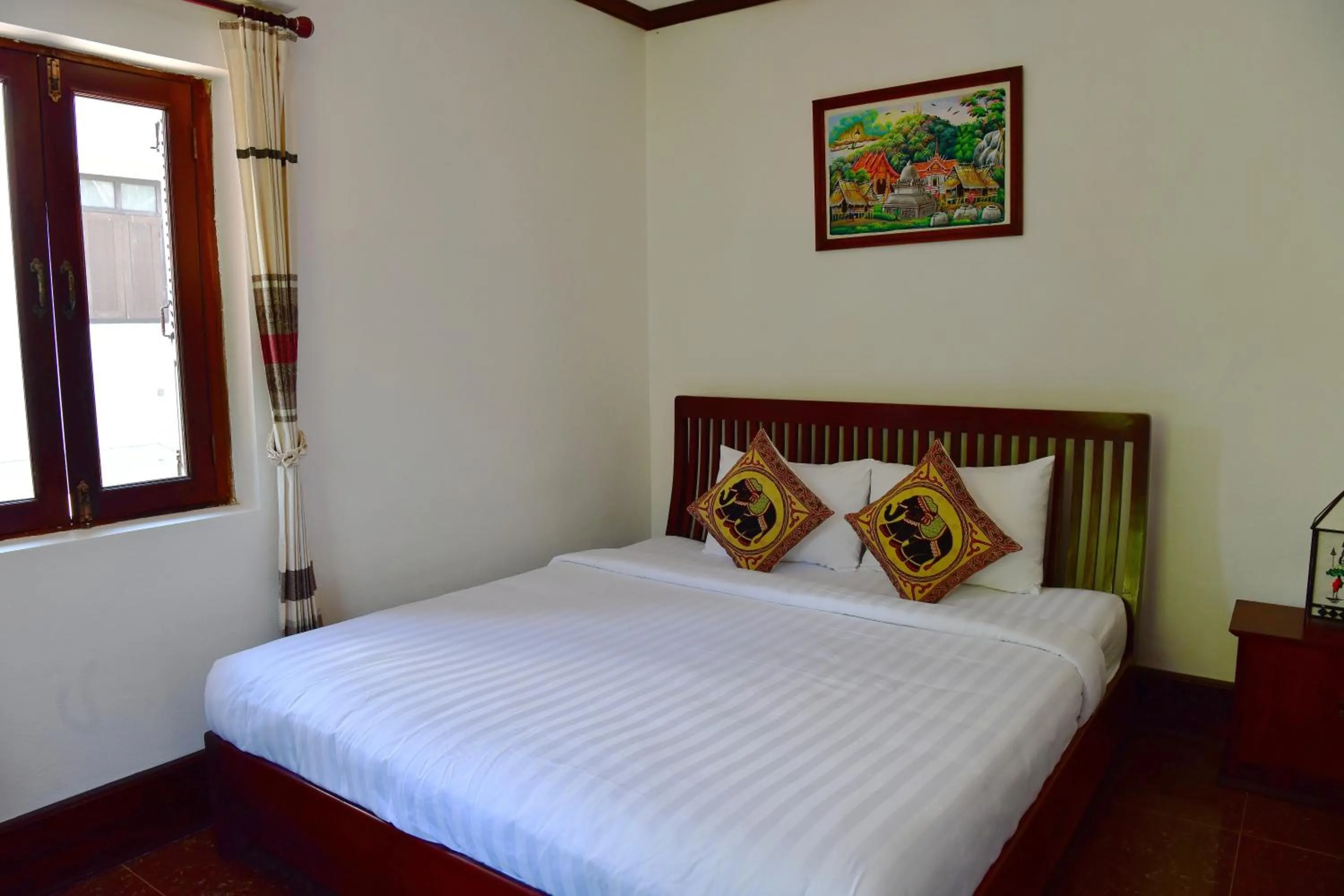 Bed in Thatsaphone Hotel