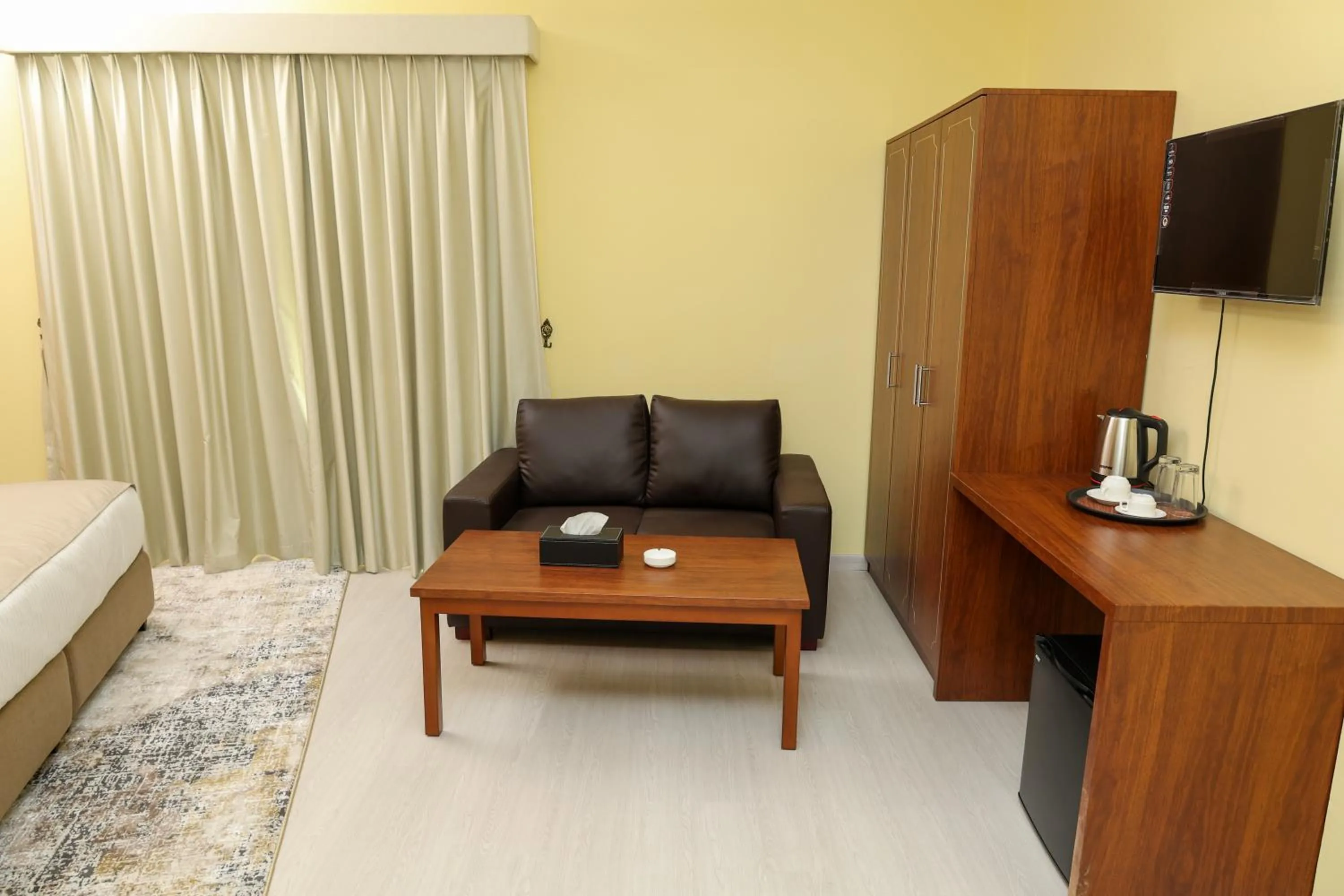 Seating area, Bed in Grand Marino Hotel