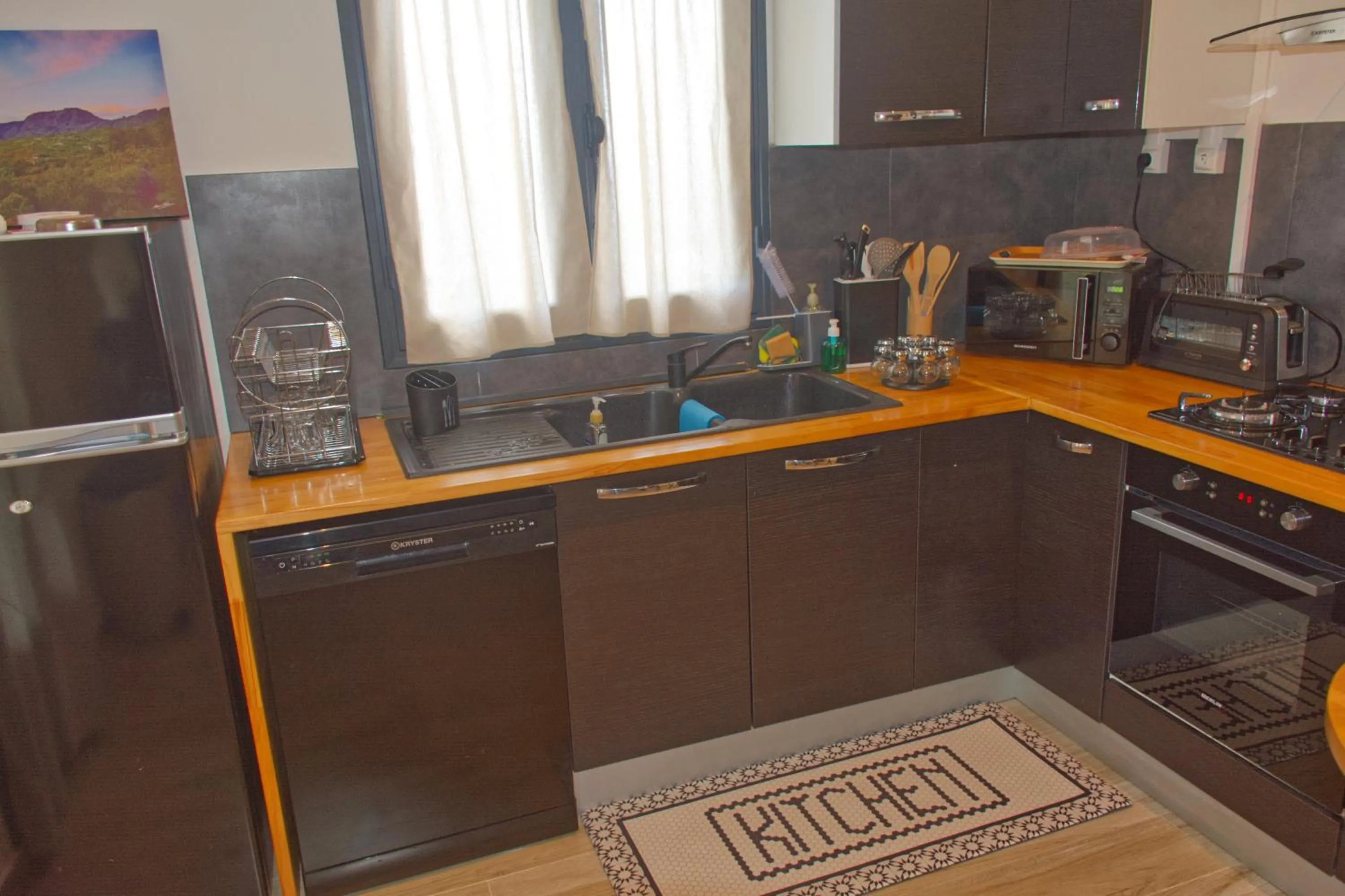 Kitchen or kitchenette in Ka Hema - Maison entière avec Jacuzzi et vue sur mer