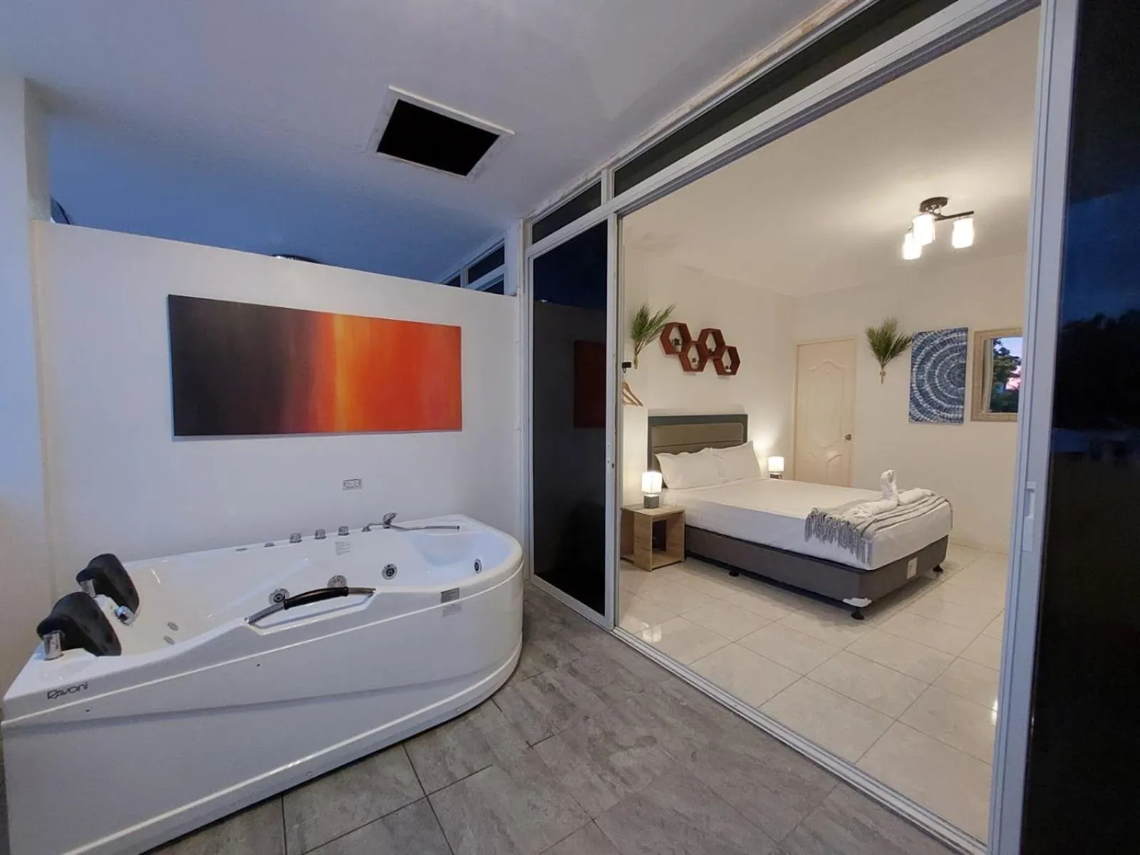 Bed in Bonsai Jacuzzi Suites