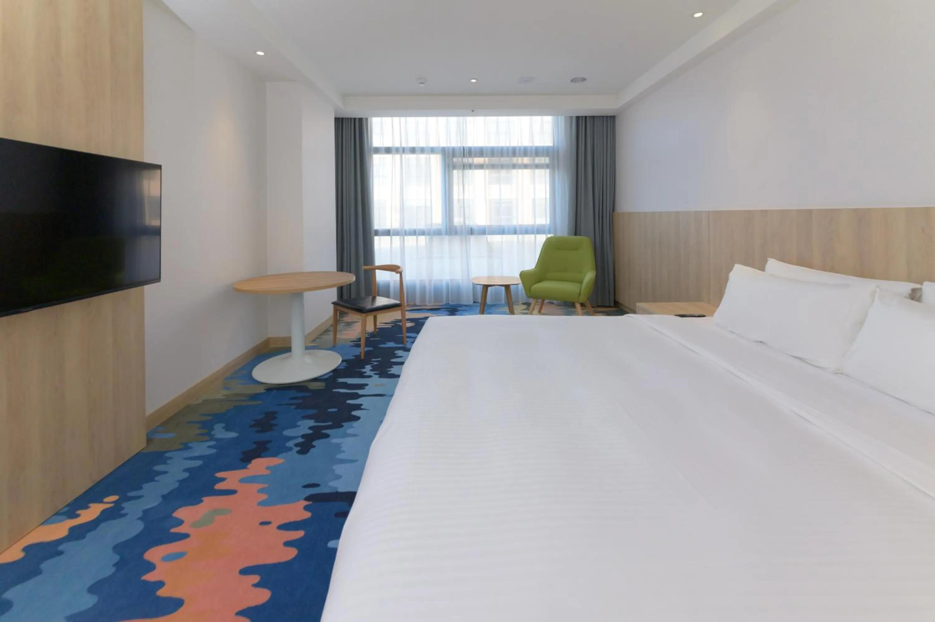 Bed in JANDA Golden Tulip Hotel