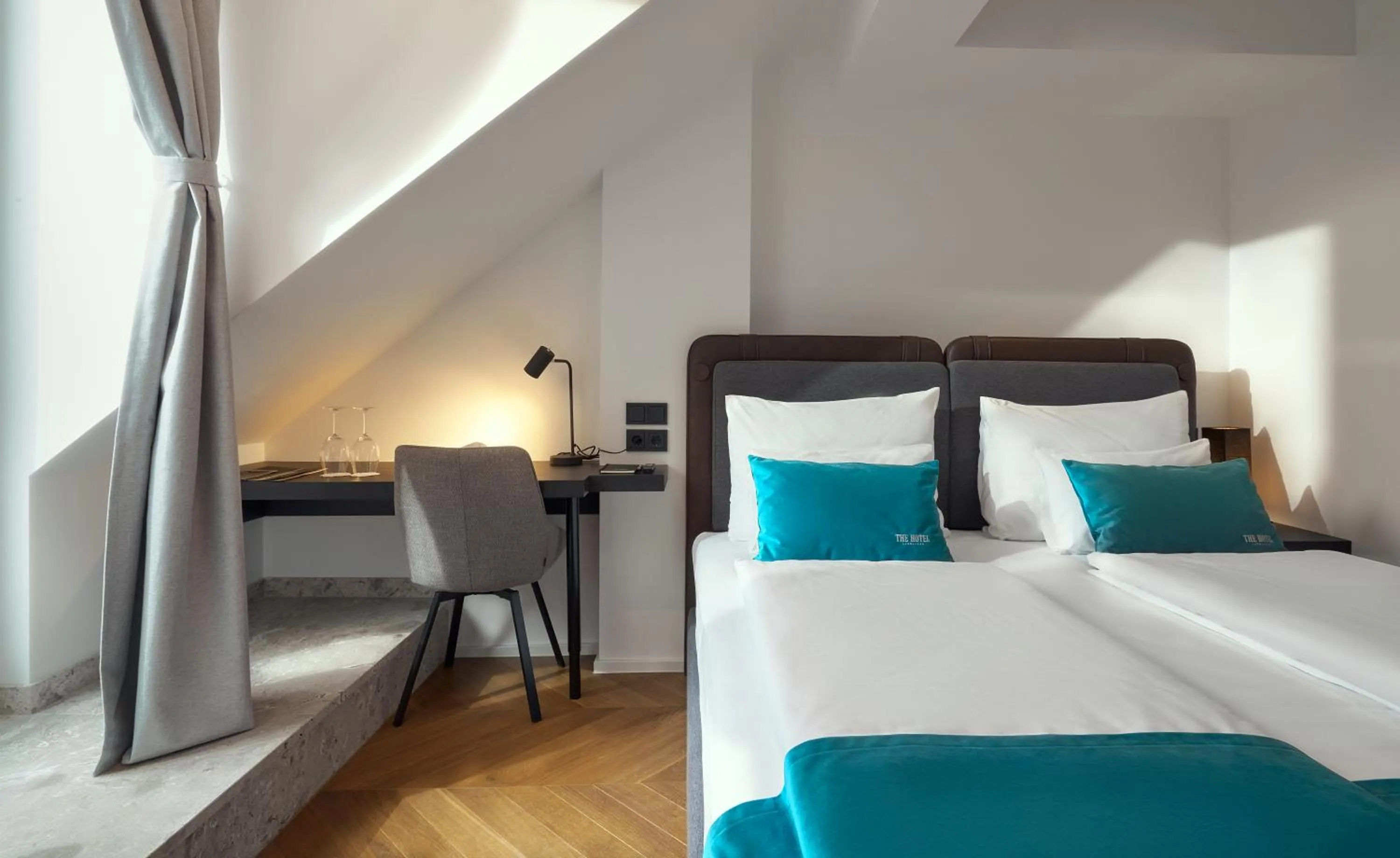 Bed in The Hotel Ljubljana