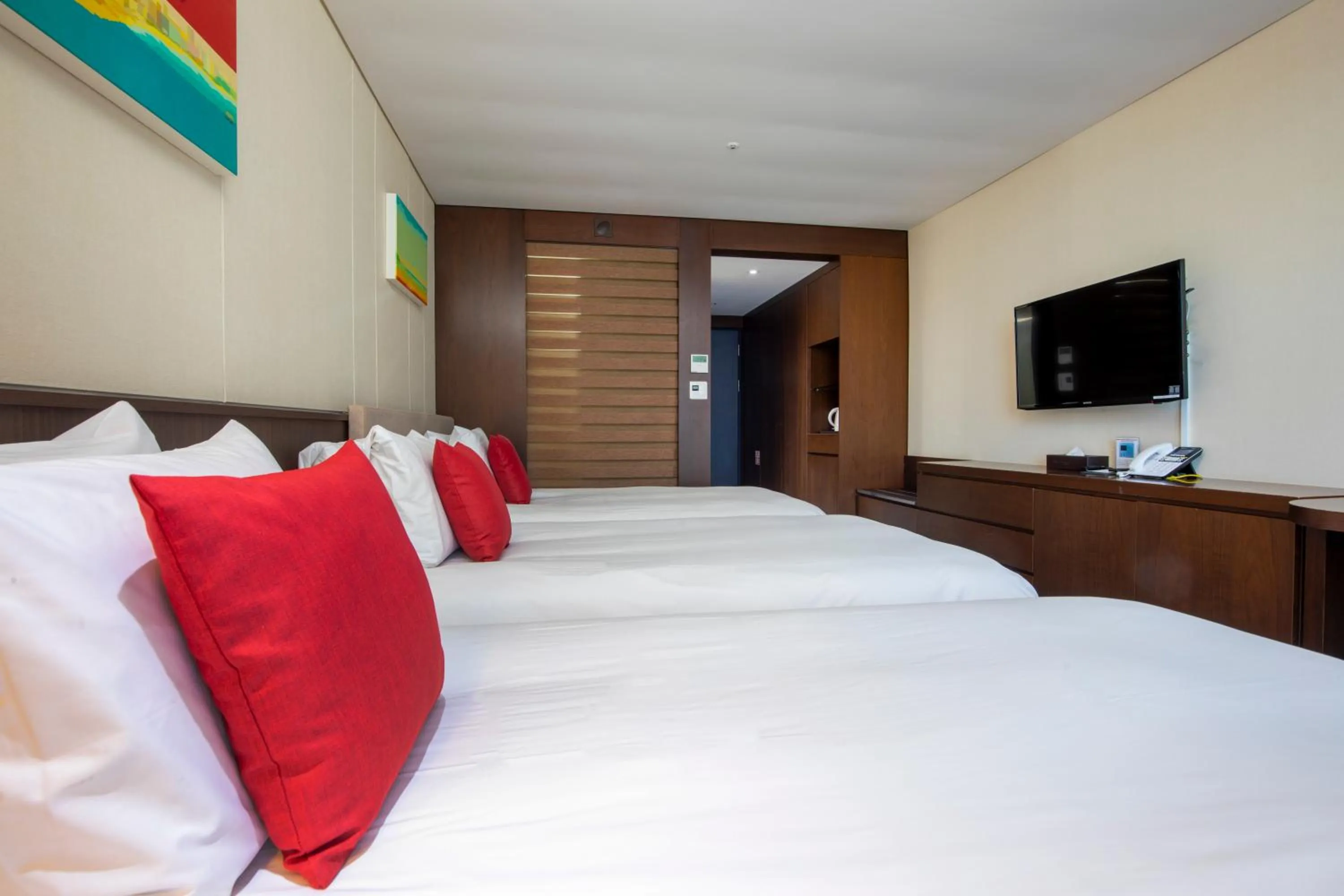 Bed in Ramada by Wyndham Jeju Hamdeok