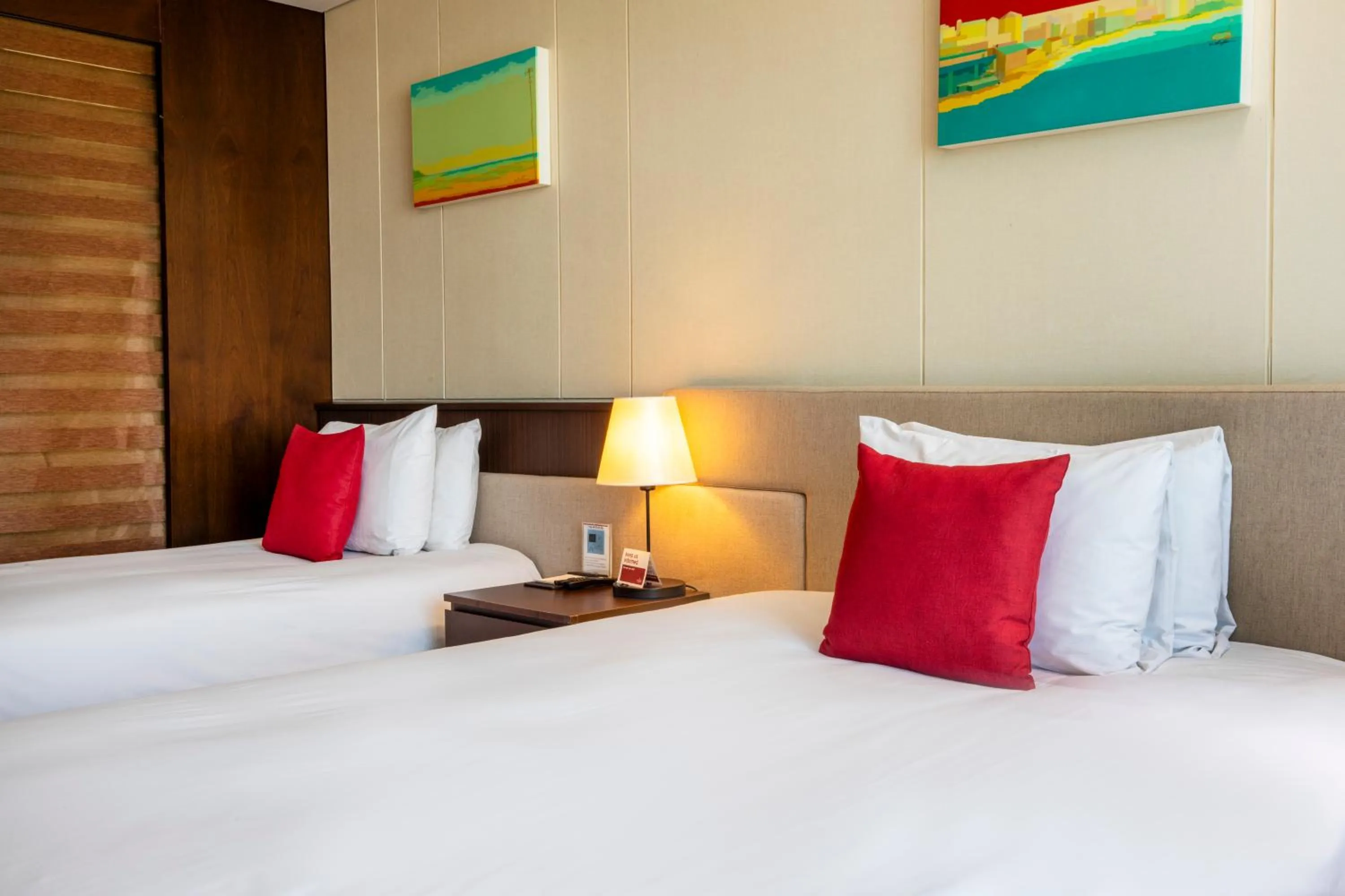 Bed in Ramada by Wyndham Jeju Hamdeok