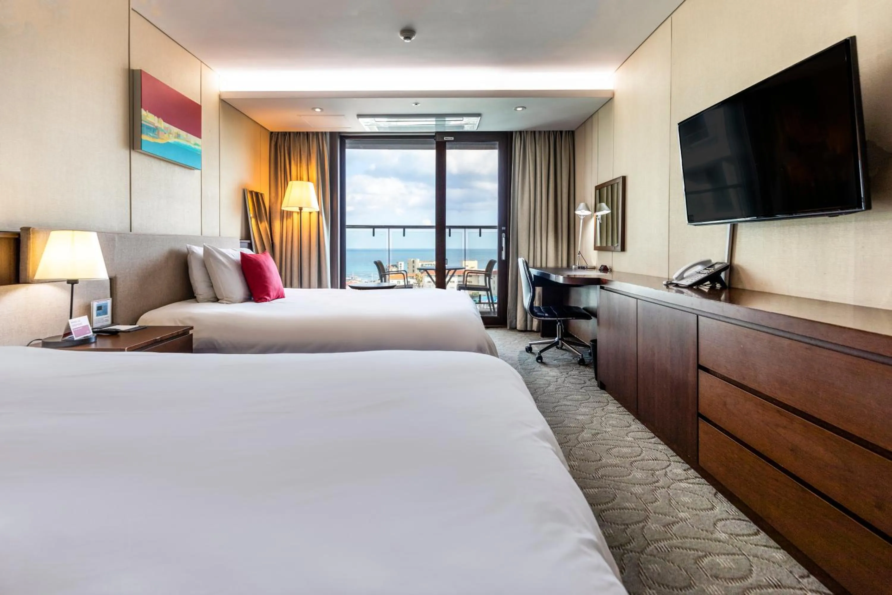 Bed in Ramada by Wyndham Jeju Hamdeok