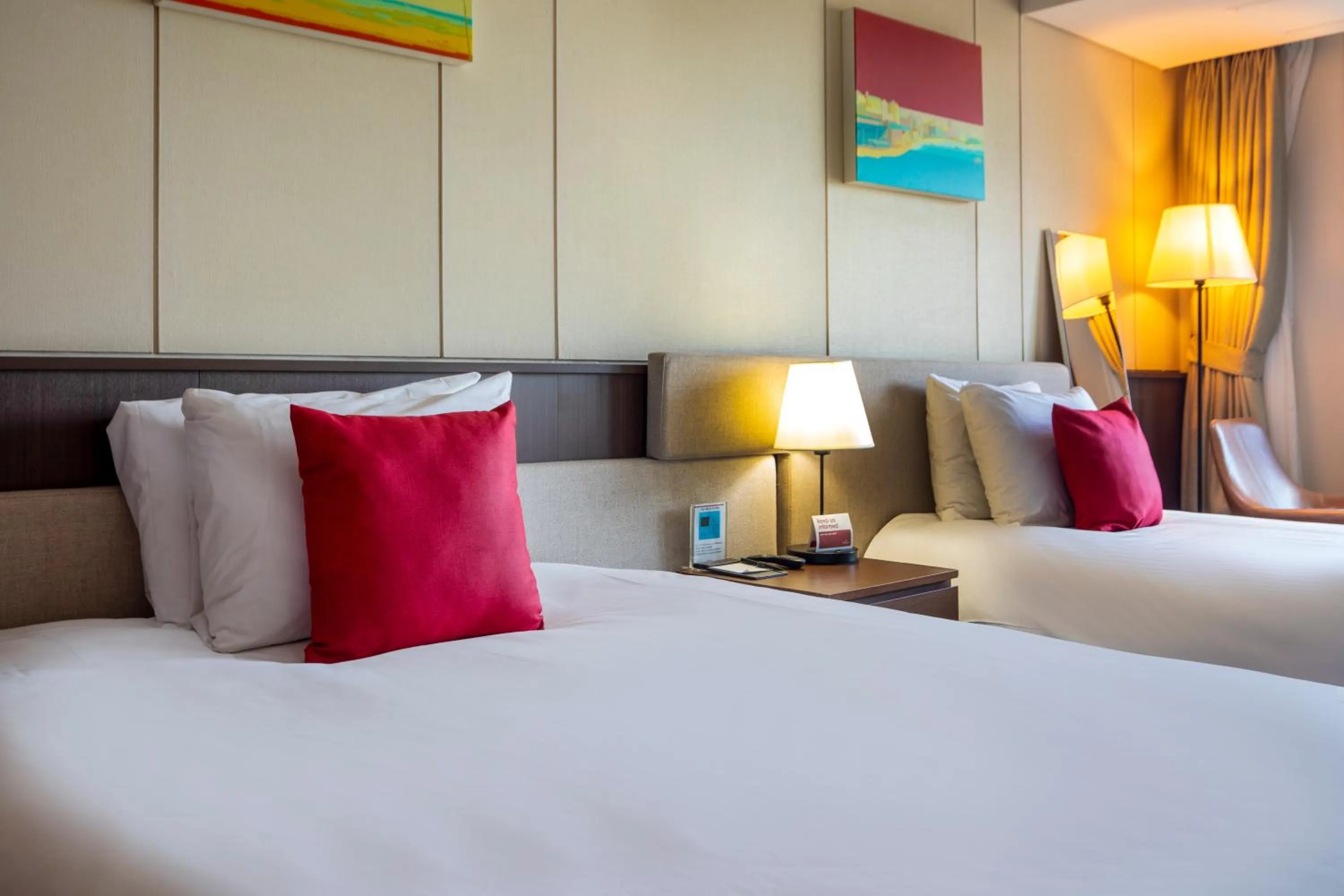 Bed in Ramada by Wyndham Jeju Hamdeok