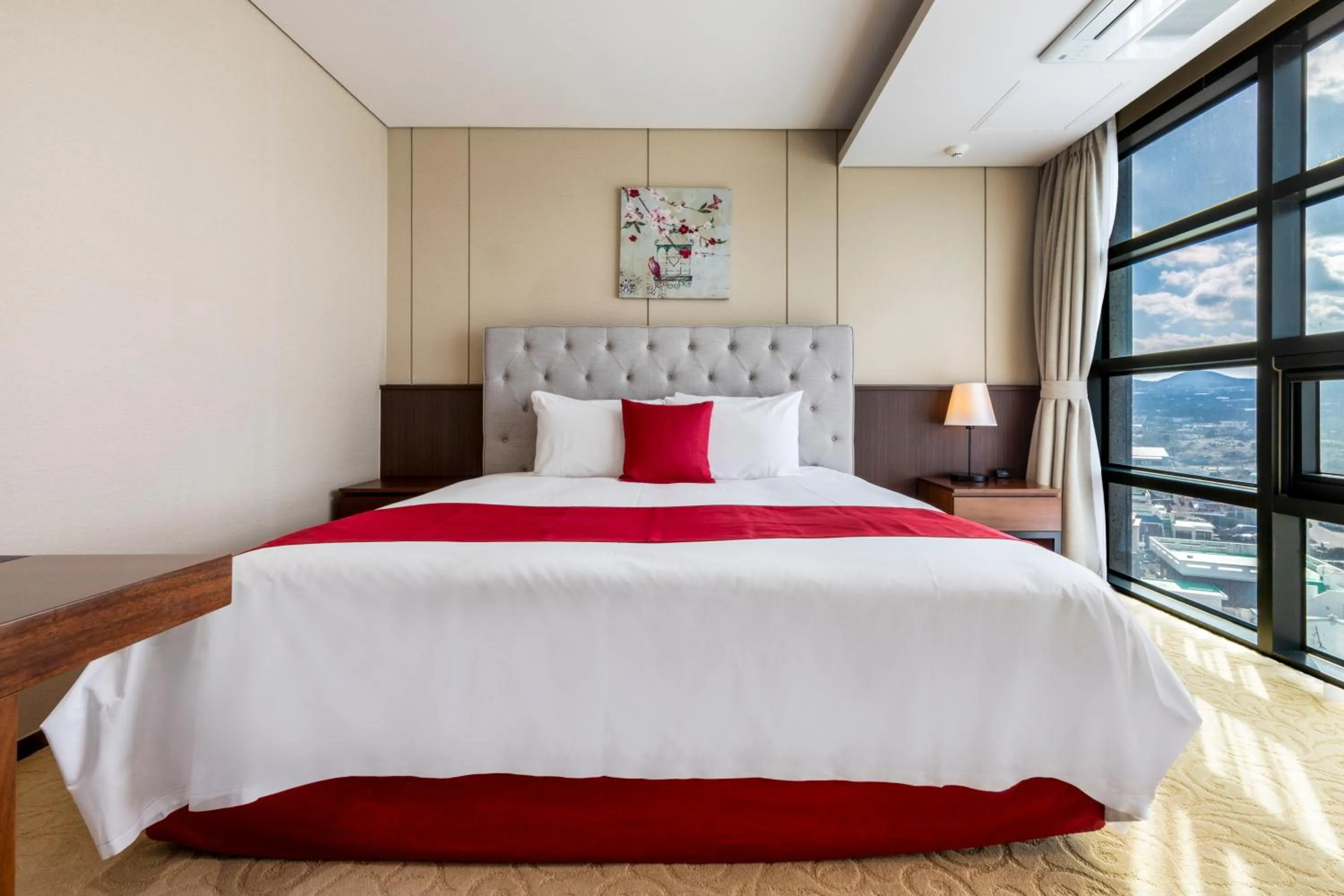 Bed in Ramada by Wyndham Jeju Hamdeok