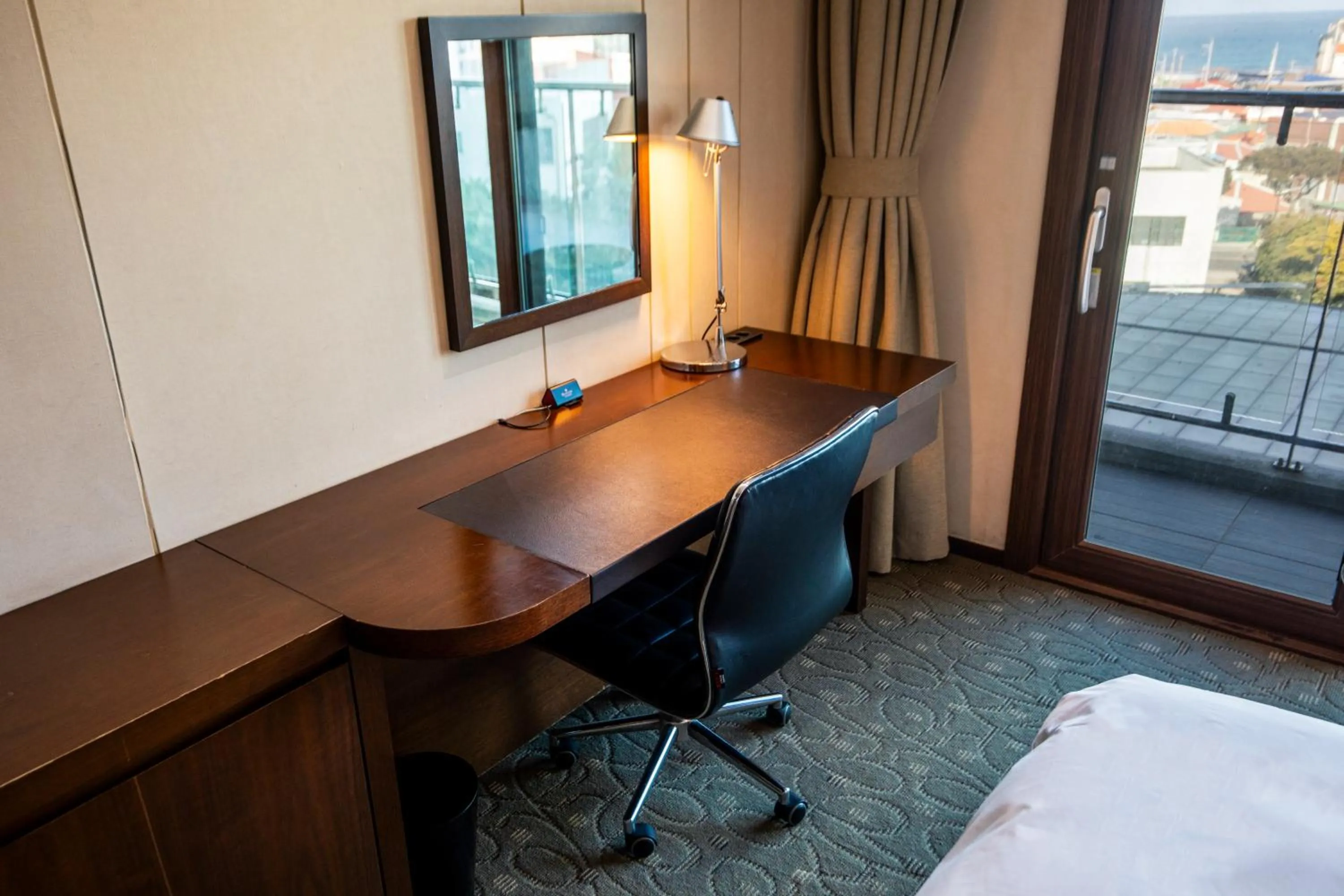 Bed in Ramada by Wyndham Jeju Hamdeok