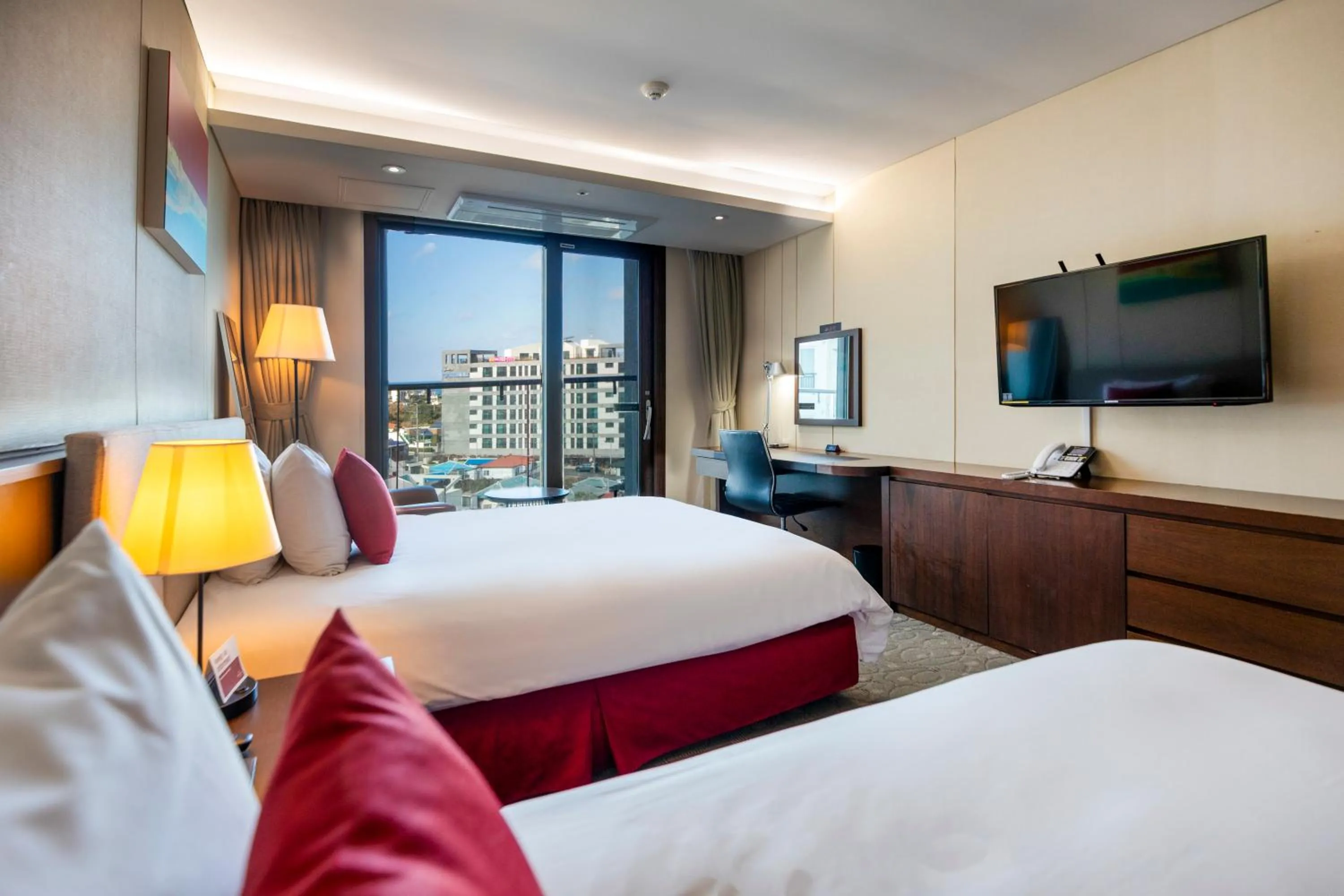 Bed in Ramada by Wyndham Jeju Hamdeok