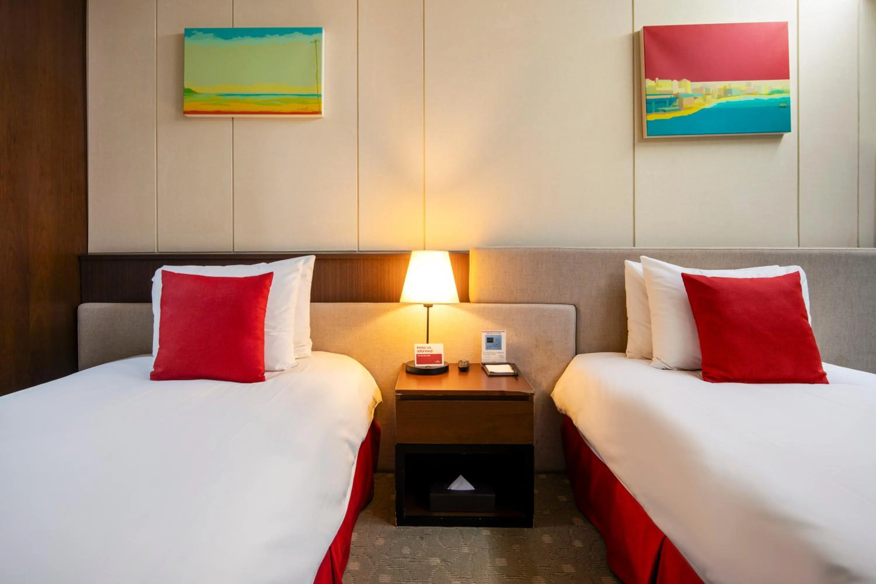 Bed in Ramada by Wyndham Jeju Hamdeok