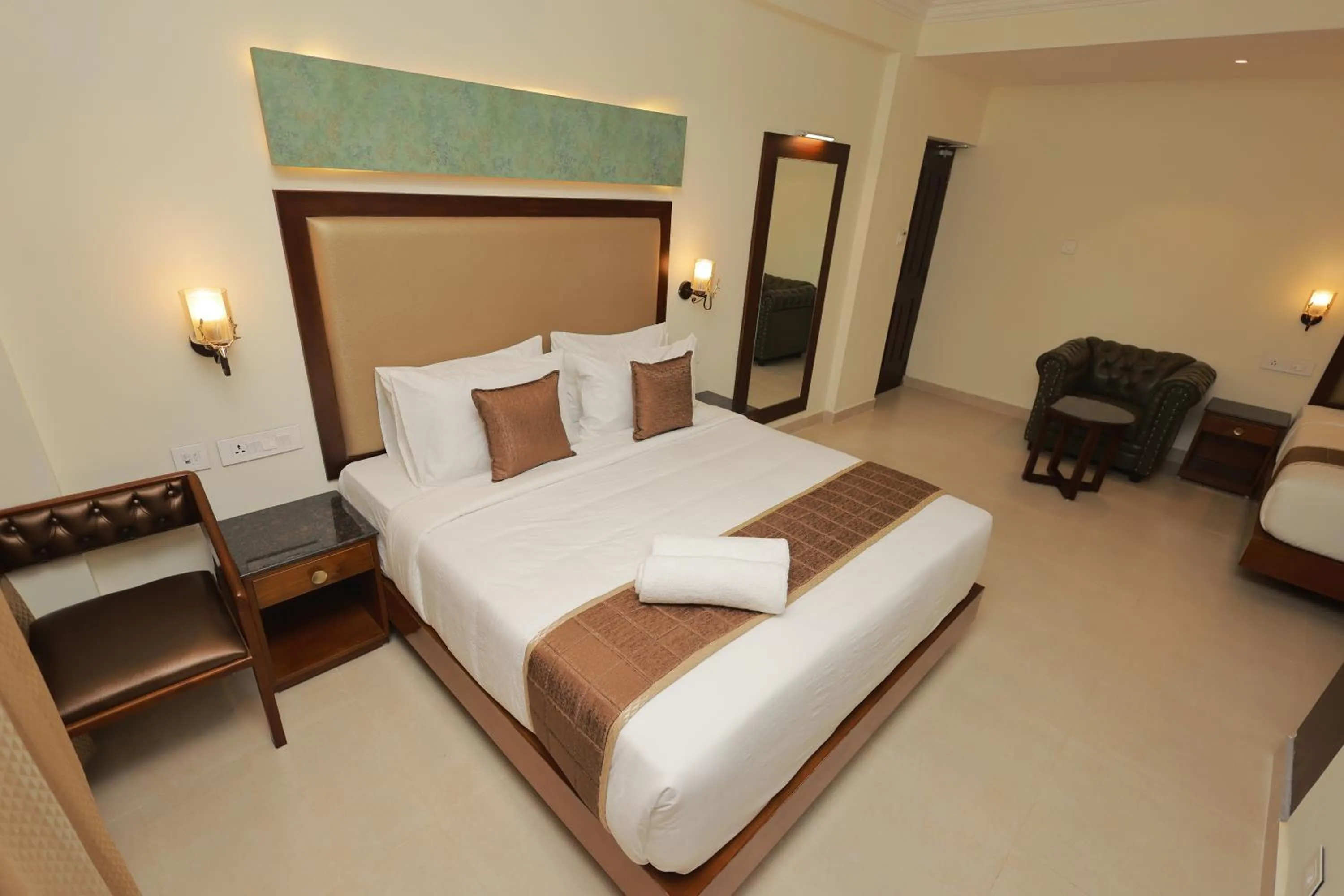 Bed in Hotel Comorin Grand