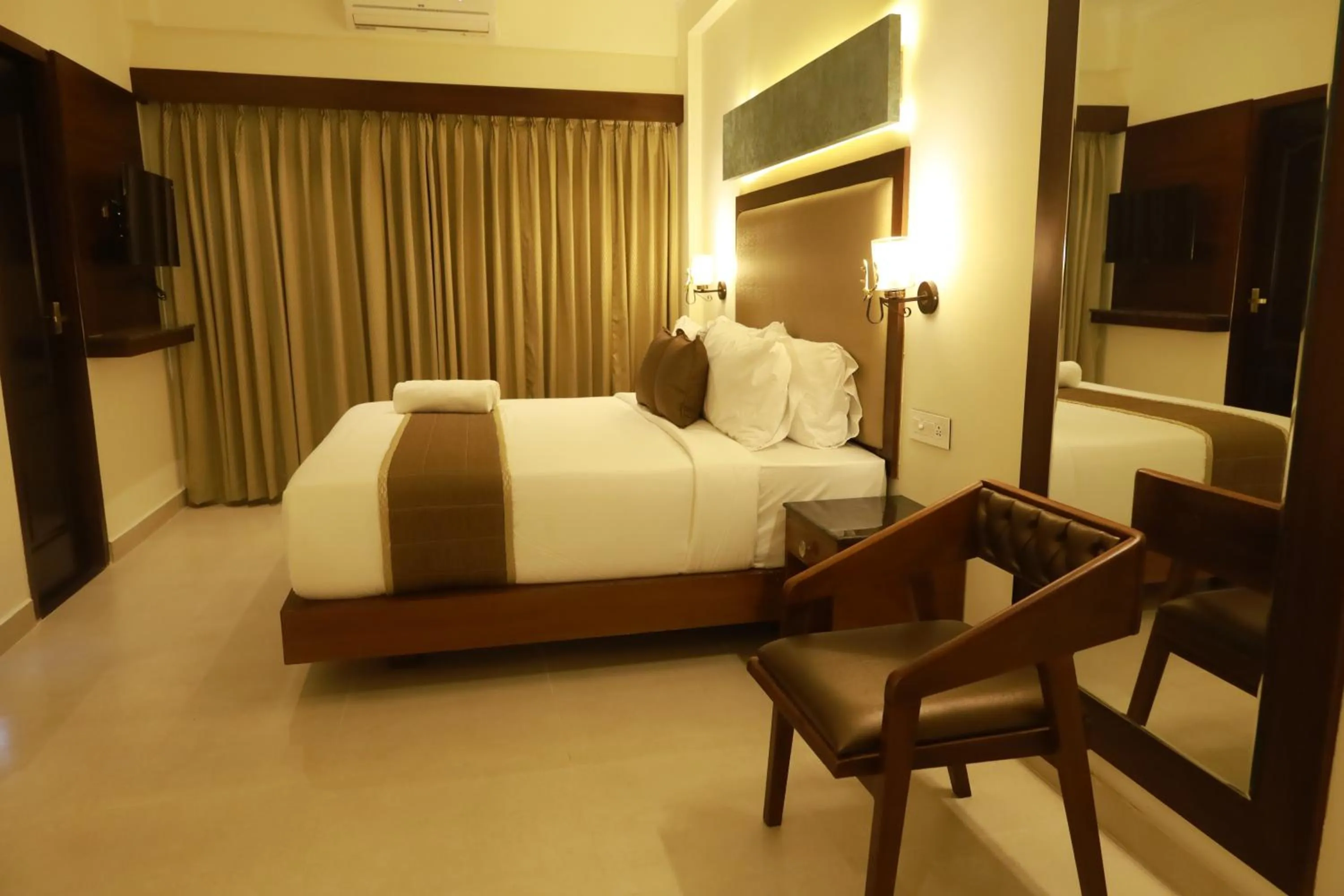 Bed in Hotel Comorin Grand