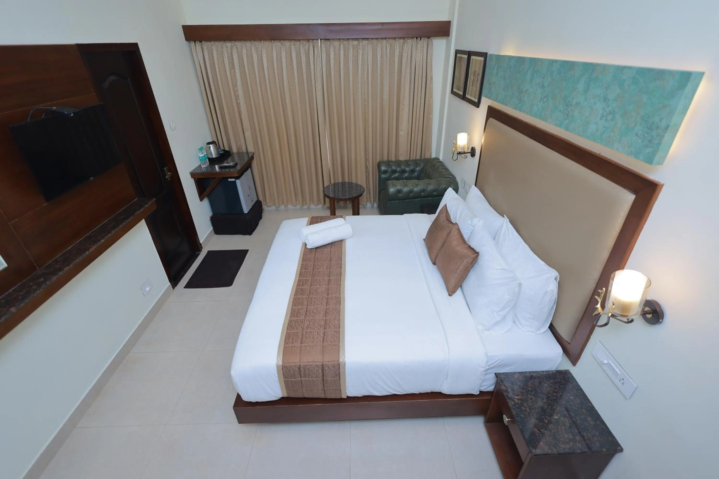 Bed in Hotel Comorin Grand