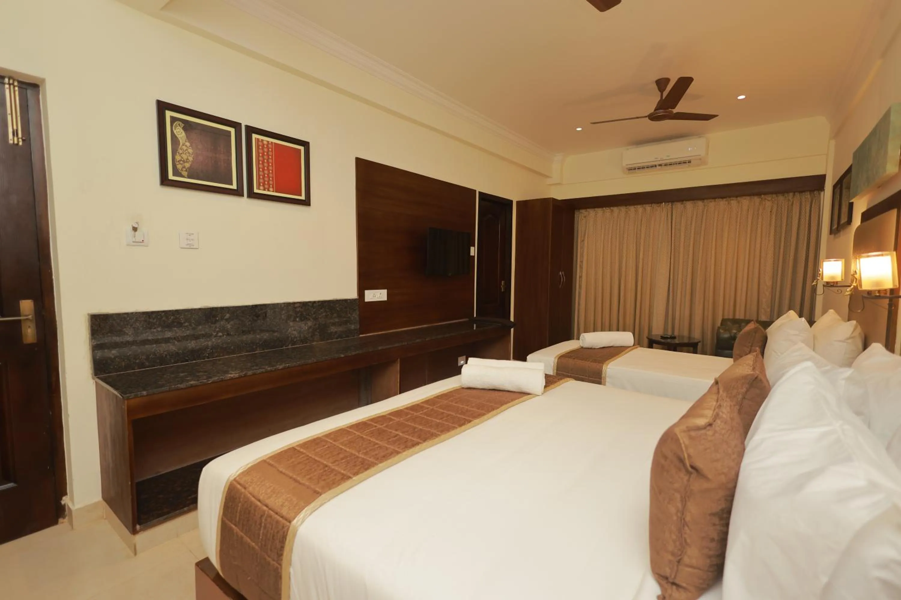 Bed in Hotel Comorin Grand
