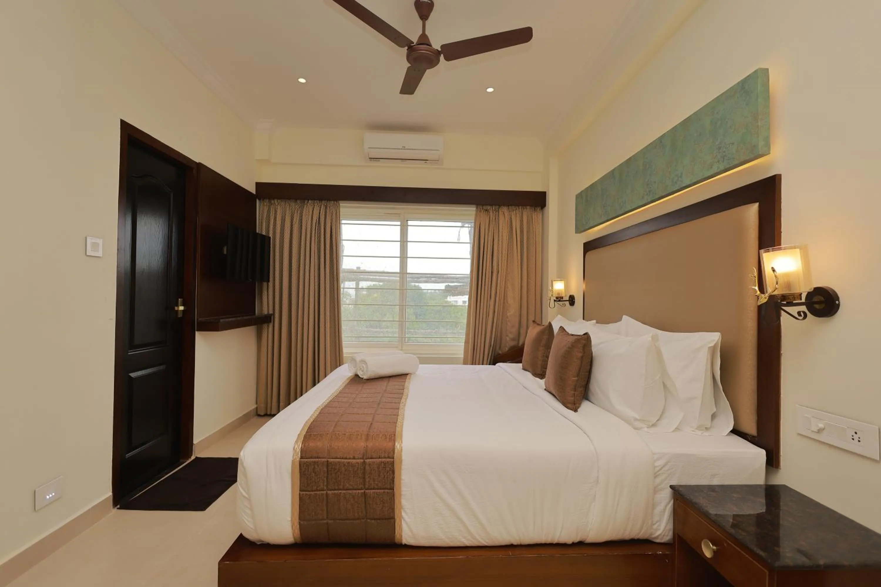 Bed in Hotel Comorin Grand