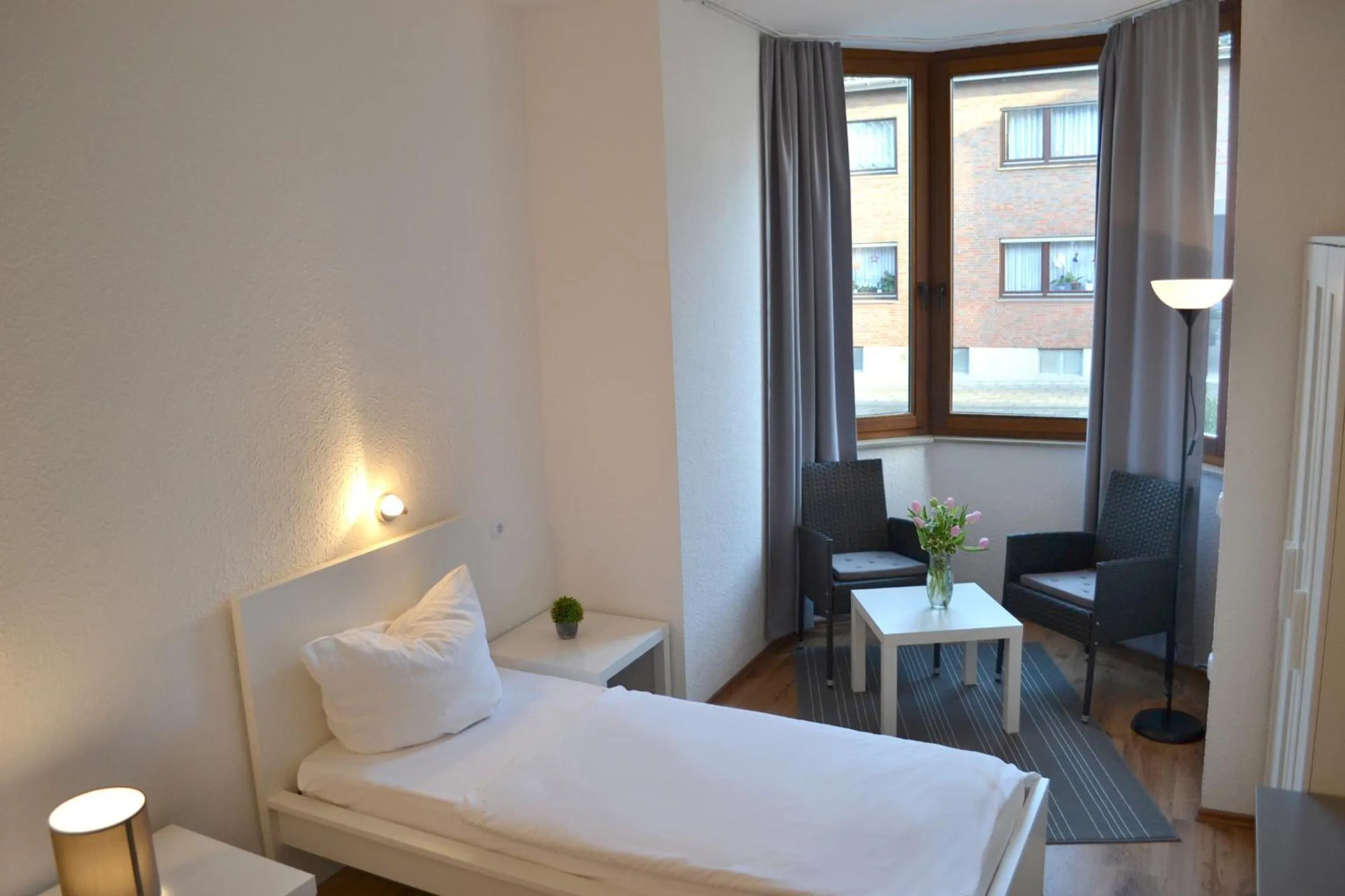 Bed in Hotel Garni Zum Dorfbrunnen