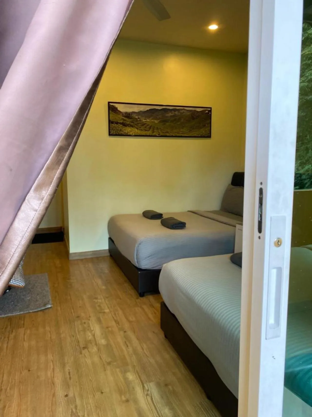 Bed in Highlanders Garden Guesthouse at Arundina Cameron Highlands