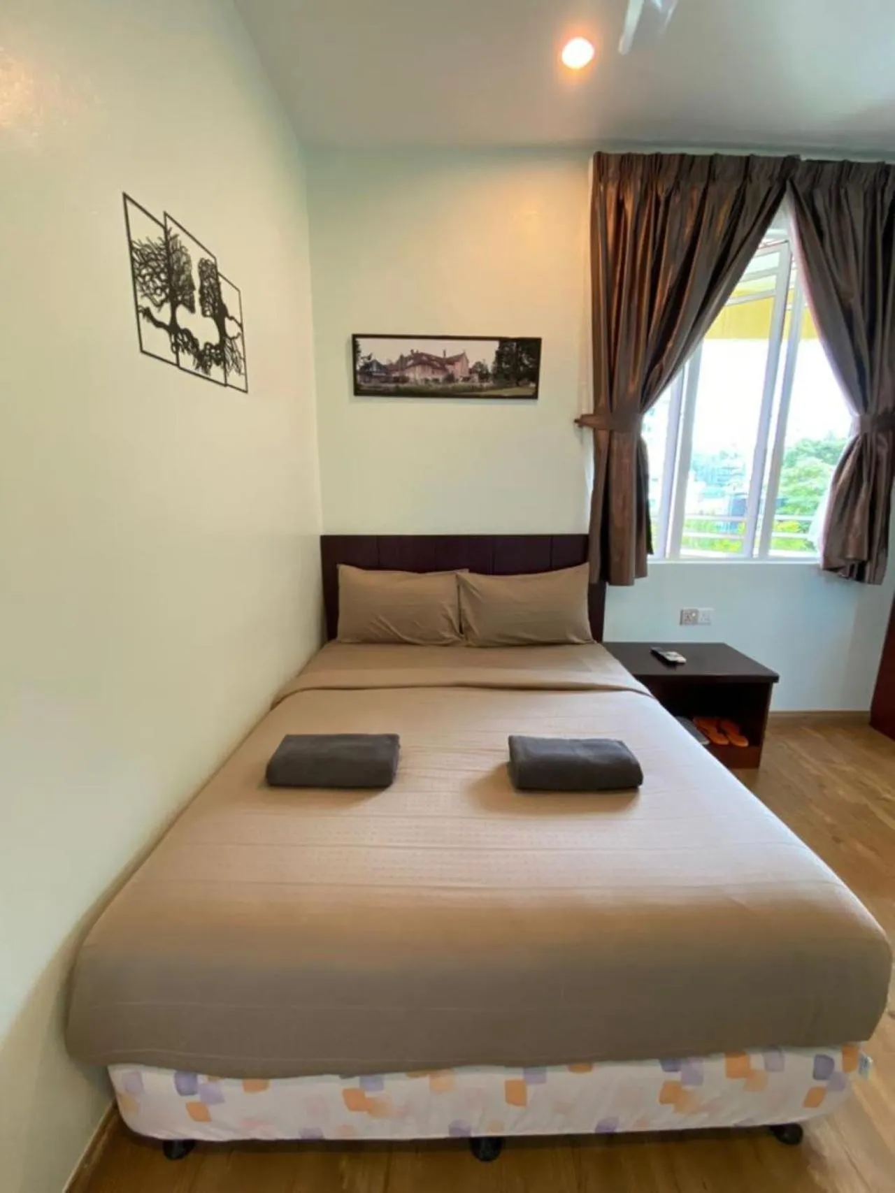 Bed in Highlanders Garden Guesthouse at Arundina Cameron Highlands