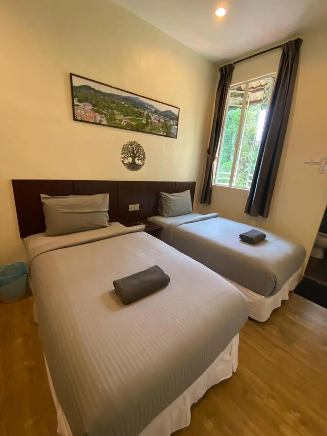 Bed in Highlanders Garden Guesthouse at Arundina Cameron Highlands