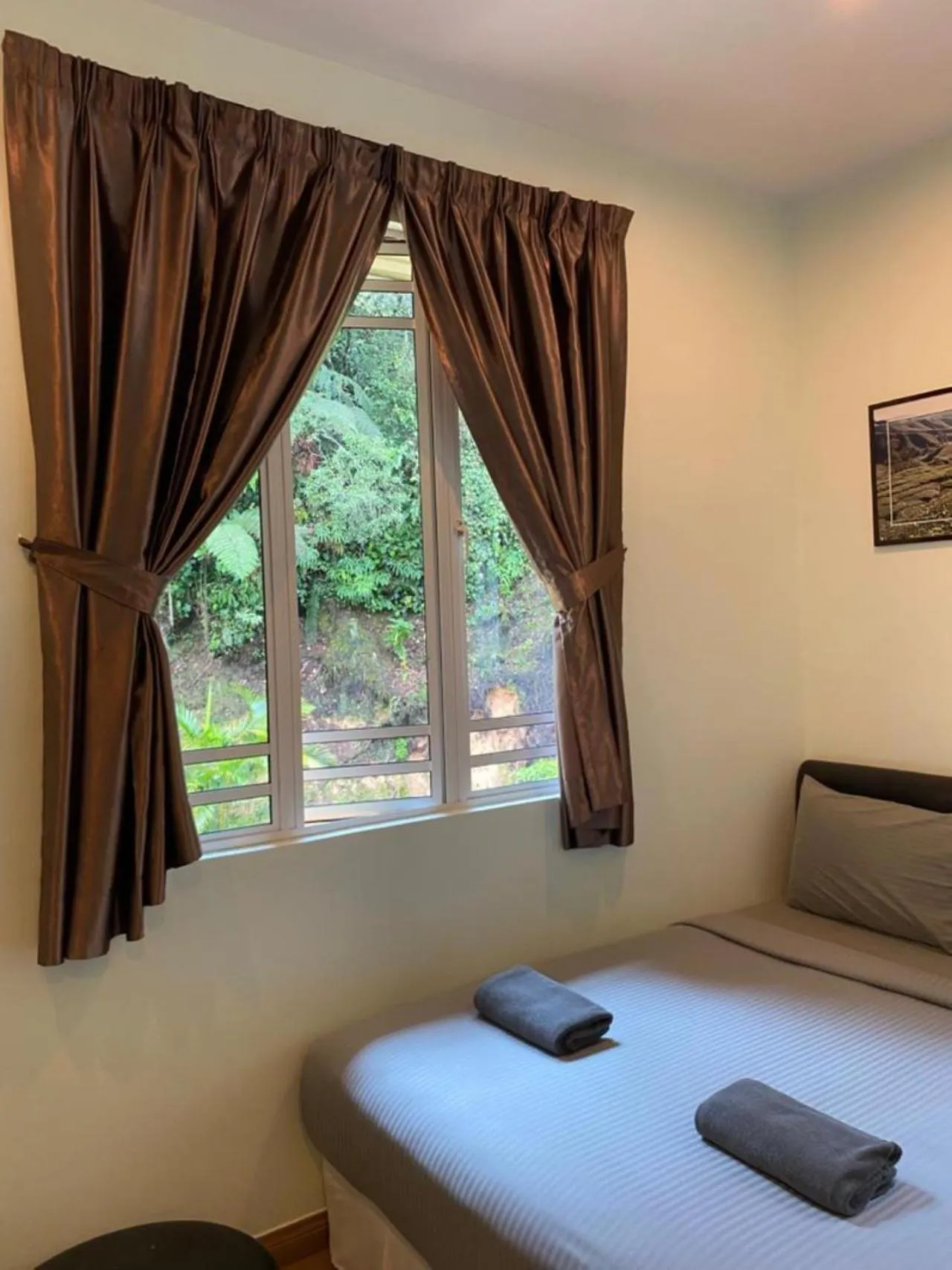 Bed in Highlanders Garden Guesthouse at Arundina Cameron Highlands