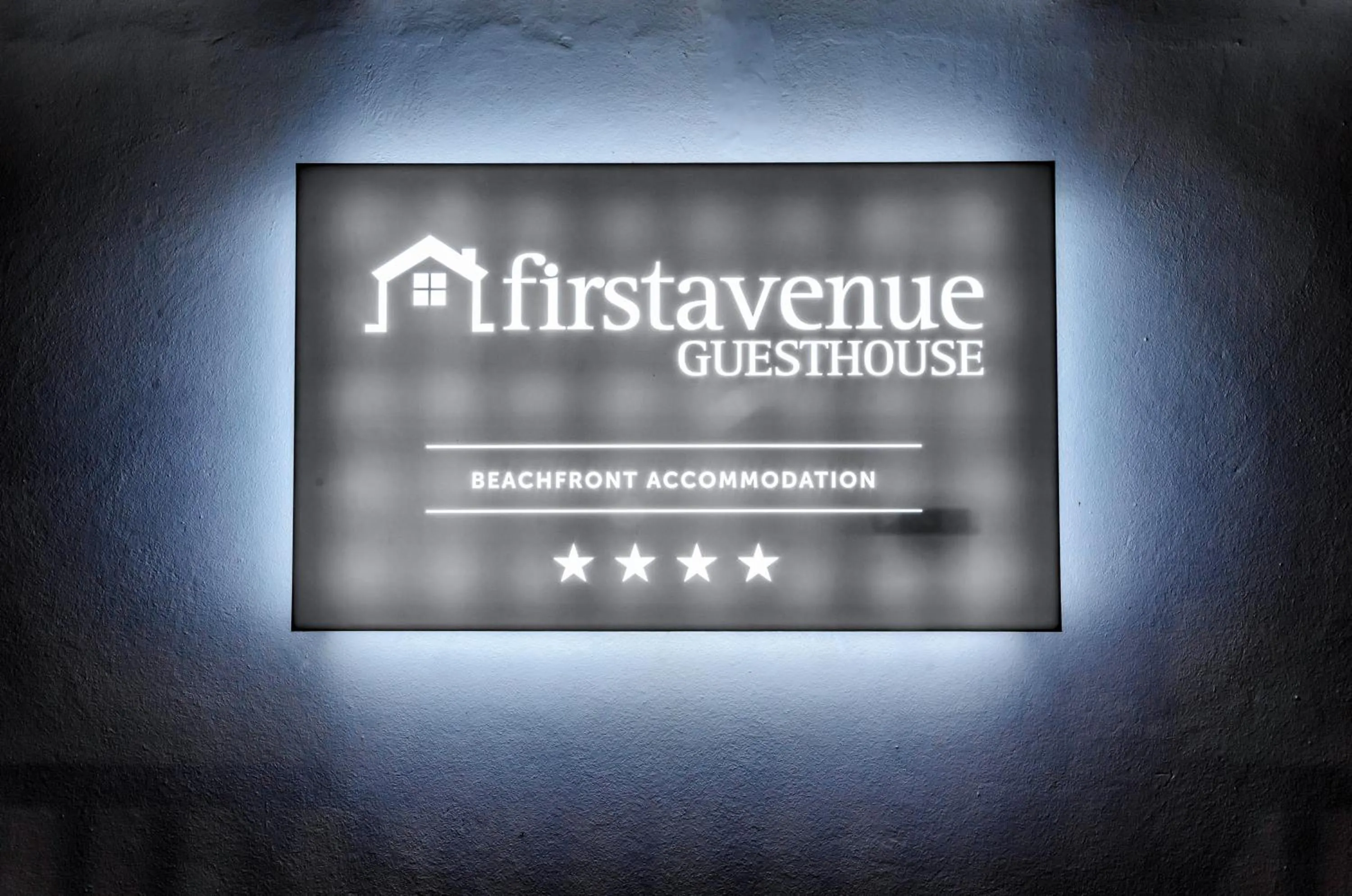 Property logo or sign in First Avenue Guesthouse