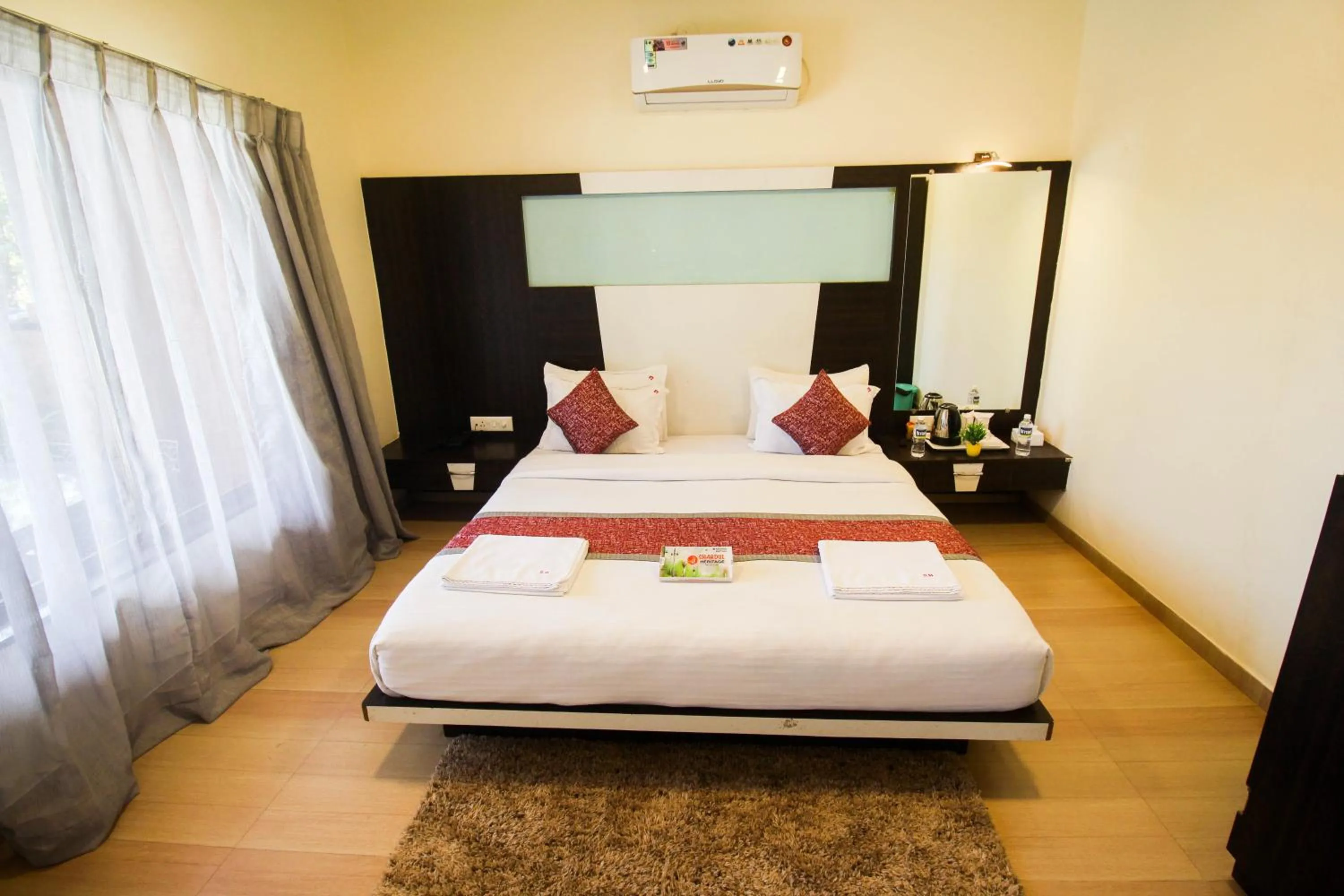 Bed in SHARDUL HERITAGE THE RESORT