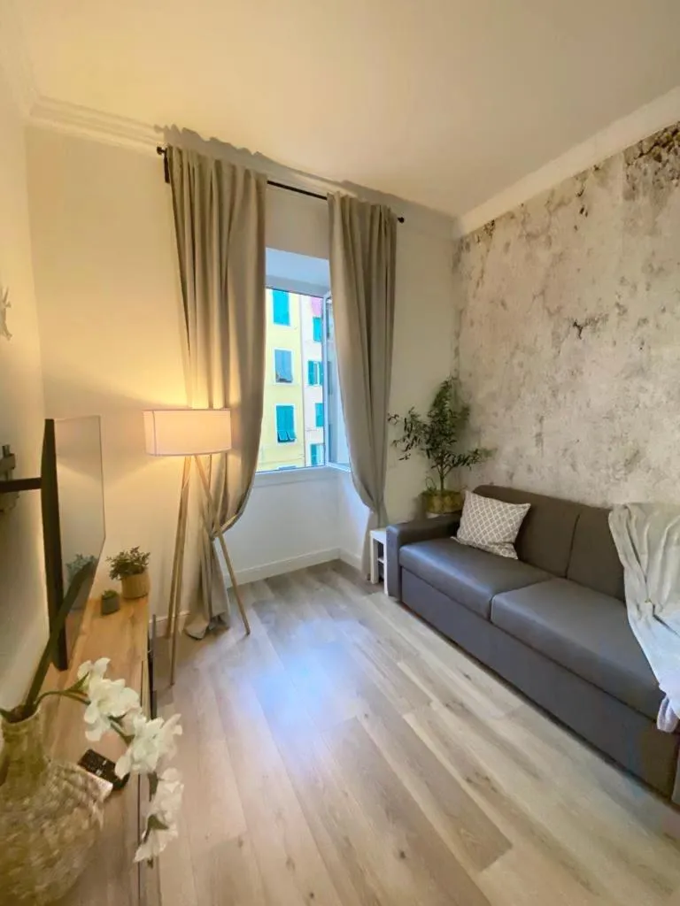 Living room, Bed in Happy Family Apartments Lavagna