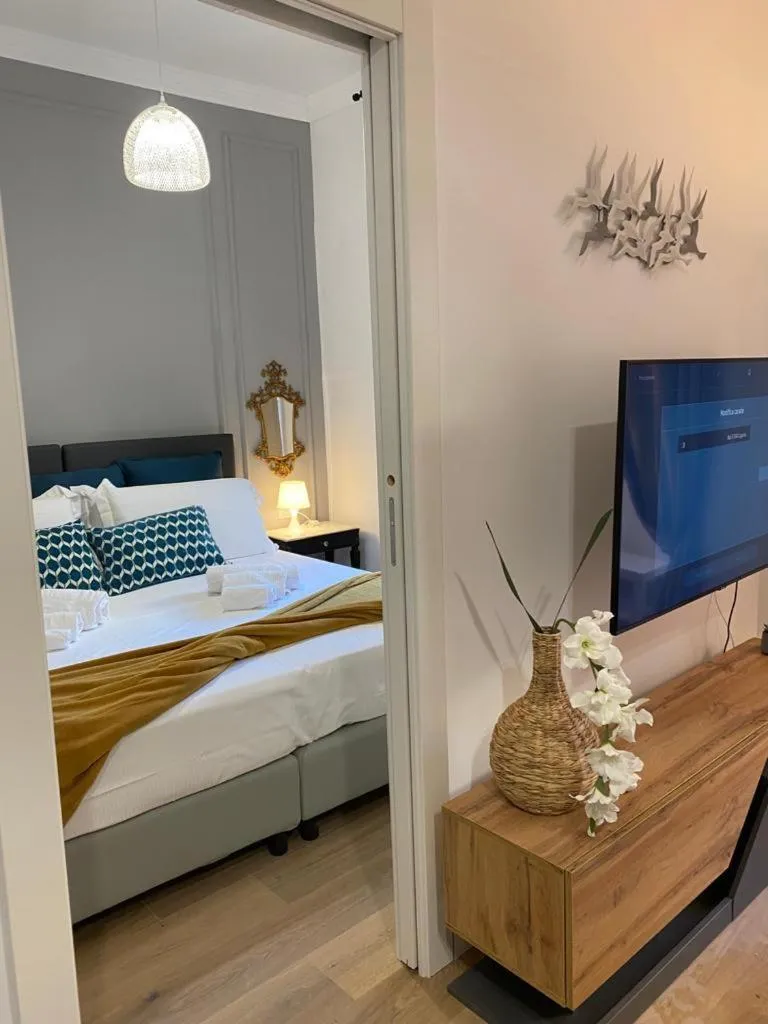 Communal lounge/ TV room, Bed in Happy Family Apartments Lavagna