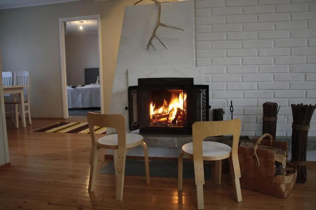 Living room in Authentic Wooden House by the River with an Igloo