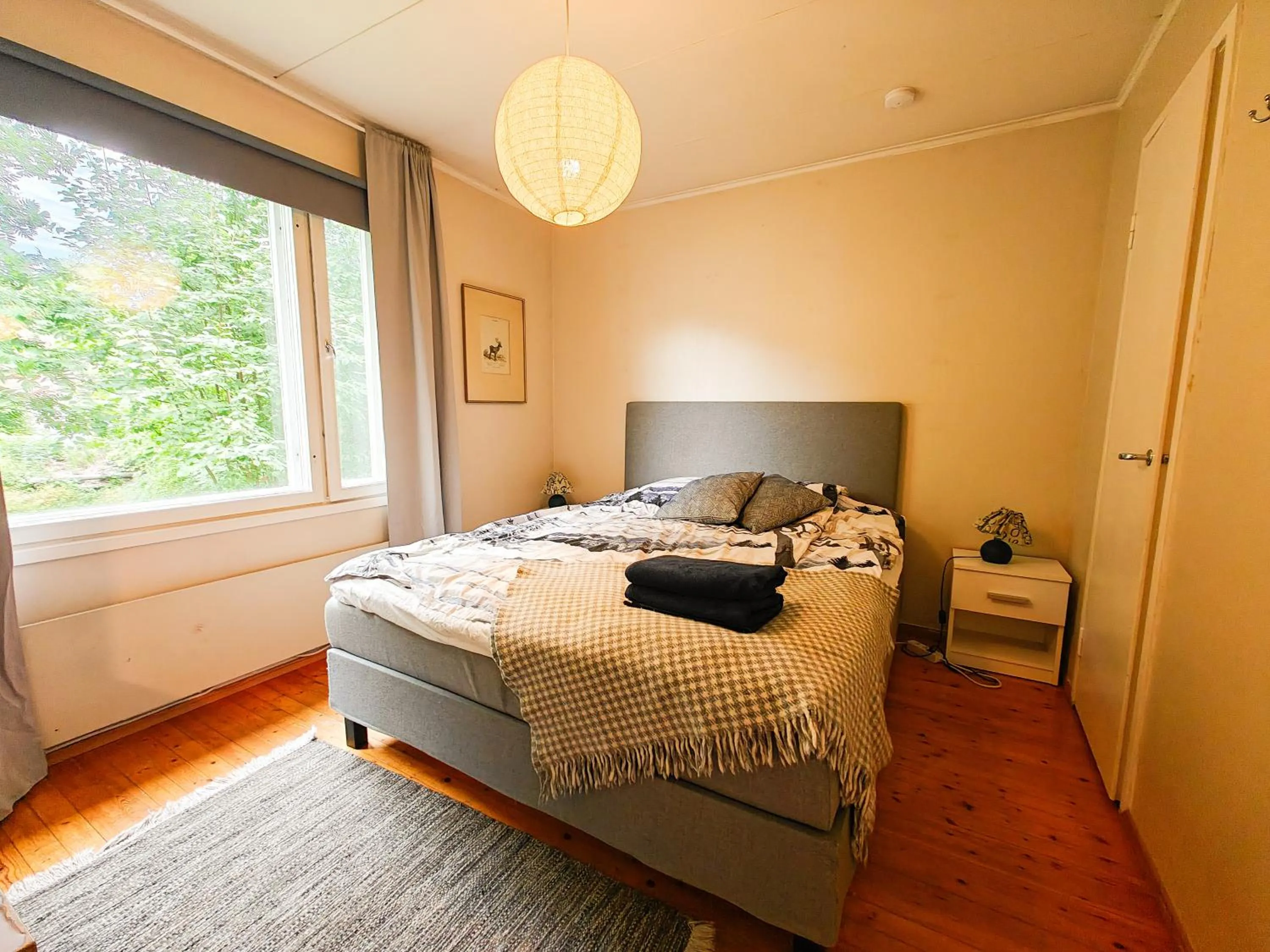 Bed in Authentic Wooden House by the River with an Igloo