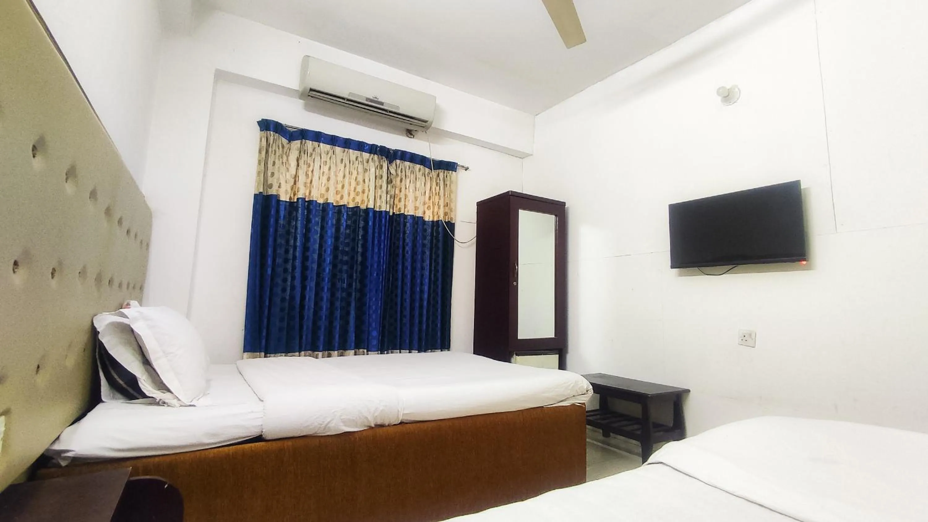 Bed in White Rose Suites Ltd